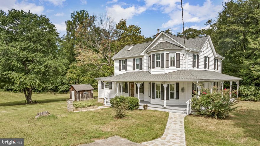 Welcome to 17300 Aquasco Farm Rd, a picturesque early-1900s farmhouse set on 5.2 private acres in the heart of Aquasco, MD. This 2,213 sq. ft. two-story home with 3 bedrooms and 2 full bathrooms combines timeless charm with comfortable country living, highlighted by a classic wrap-around porch perfect for morning coffee or evening sunsets.

Inside, you’ll find a spacious layout with original architectural details ready to be cherished or reimagined to suit modern living. The main level features a bedroom and full bath, a large living room, family room, a generous country kitchen, and a mud room with washer and dryer. Upstairs offers two additional bedrooms and another full bath.

The property also includes six outbuildings—a large barn, detached garage/workshop, and multiple sheds—providing endless versatility. Mature shade trees and wide-open spaces create an inviting setting for gardens, hobbies, and outdoor entertaining. 

Whether you dream of a peaceful retreat, a working homestead, or simply more room to spread out, this property offers endless potential—all within commuting distance to Washington, D.C. and Southern Maryland. Don’t miss this rare opportunity to own a historic farmhouse on acreage!