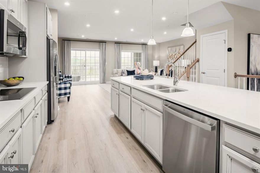 QMI  PICASSO!  Perched atop the Matisse, this unique two-level home is designed to be both practical and stylish. The first floor features plenty of room and an open floorplan that lets light flow through the entire area.  A design that is perfect for entertaining, the main level is open and flows throughout.   The kitchen is a gourmet’s dream with huge work island and plentiful cabinets.  

A powder room and coat closet are conveniently located just off the stairs.  The kitchen opens to a large great room which expands over the entire rear of the home.  Step through the great room to the stunning sky lanai giving you covered outdoor living space with an optional outdoor fireplace.  

Upstairs is a truly magnificent Owner’s Suite featuring dual walk-in closets, sitting area, and a bath with an oversized shower, dual vanities and a compartmentalized water closet. You can choose to upgrade to a separate soaking tub and shower for a spa-like feel. Past a convenient linen closet and 2nd floor laundry are two generous bedrooms and a bath with a double bowl vanity. The Picasso comes standard with a one-car garage.

Please note: Lot premiums may apply. Other floorplans and homesites are available. Photos are representative. Model is located at 100 Lawndale Drive, Bowie, MD 20716. Closing Assistance Available with Use of Sellers Preferred Mortgage.