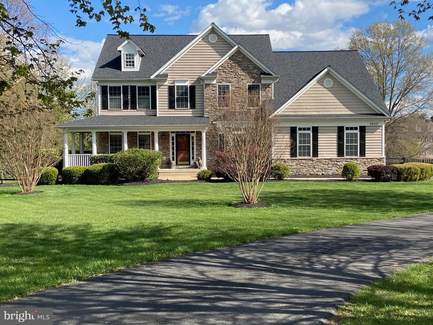 Follow the aptly-named Tranquility Road to the bucolic neighborhood of Farmington on the Green to find your next home!   This gorgeous colonial sits on over three acres on the lovely and quiet Innisbrook Circle with  a lovely wrap-around porch.  It features formal living and dining rooms with crown molding  on the main floor along with a large, roll-your-sleeves-up-and-cook kitchen with stainless appliances and granite counters. A large counter overlooks the breakfast nook and a  large family room  all warmed by a pellet stove. Upstairs is a spacious primary suite with a brand new shower, tiling and glass.  The suite  also has a cozy sitting room with a gas fireplace as well as two walk in closets. Three other upstairs bedrooms and an upper level laundry  are complimented by fifth bedroom or office and full bath on the main level. A three-car garage enters into a  spacious mud room, also plumbed as a second laundry. Many of the  home's systems are upgraded and nearly new including a 2023  HVAC, 2022 new roof, and 2020 hot water heater. For outdoor living, a huge deck overlooks a large back yard with views toward the sunset . Less than two miles from downtown Purcellville, Farmington is a historic neighborhood, with lovely open spaces throughout the community.  It is adjacent to and with easy access to Franklins Park's 200 acres of  hiking trails,  water park, fishing pond, tennis courts, base ball and soccer fields as well as a Performing Art Center. Sit on your deck and enjoy the park's fireworks on July 4th. Farmington on the Green is the perfect combination of peaceful country living and proximity to town and commuting options. Come visit today!