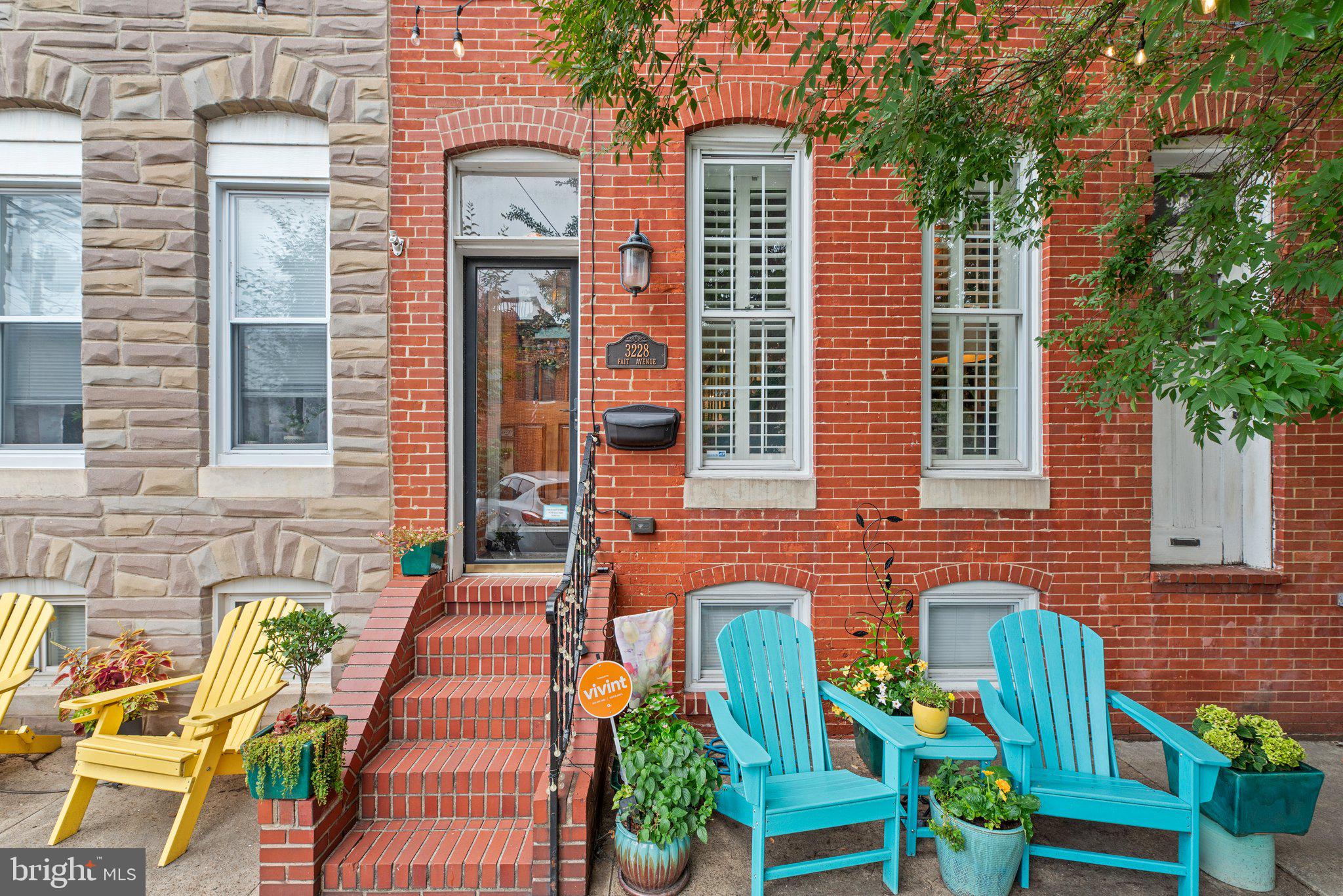 Welcome home to your Canton gem, full of timeless charm and well-appointed updates throughout. Step inside to a warm, inviting living space that instantly feels like home, featuring a decorative exposed brick wall, a cozy gas fireplace, and exposed beam ceilings. The home has been beautifully modernized while maintaining its classic character, offering the perfect blend of old-world charm and contemporary comfort. The updated kitchen boasts granite countertops, stainless steel appliances, and a breakfast bar that opens seamlessly to the living space, along with a convenient powder room and washer/dryer nearby. Out back, a partially covered parking pad adds practical ease to everyday living. A modern floating staircase with soaring ceilings leads upstairs, where each bedroom features a charming touch of exposed brick. The owner’s suite, tucked at the rear for privacy, offers a full bath with a shower and a private deck—an ideal spot for morning coffee or quiet evenings. A second bedroom is served by a hall bath with a jetted tub/shower combo. The lower level offers a large open space with a built-in window seat and plenty of storage. This versatile/flexible space is perfect for an in-home office or studio, or additional space for visiting family or guests. All this in a prime location—just steps from O’Donnell Square, Canton Waterfront, Patterson Park, the Highlandtown Arts District, and Brewer’s Hill, with Fells Point close by. Tucked on a wide, tree-lined street with charming string lights, this home is truly one of a kind.