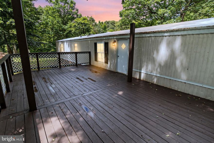 MULTIPLE OFFERS HIGHEST AND BEST DUE BY TUE JUNE 11 @ 4PM
Welcome to your peaceful rural oasis near Sleepy Creek Wildlife Management Area! This 3-bed, 2-bath single wide trailer sits on 2.41 unrestricted acres and has been beautifully remodeled with fresh paint, all new bathrooms, flooring, countertops, stove, dishwasher, light fixtures, and so much more!

Inside, you'll find a cozy living space, a fully equipped kitchen, and three comfortable bedrooms. Step outside to enjoy a large deck at the front, a covered porch at the back, and your brand new above ground pool.

The property also features lovely gardens and a shed that could be used as a barn or chicken coop. With its prime location near outdoor attractions, this is country living at its finest. To add even more value there are 2 wells and 2 septic systems on the property! Don't miss out—schedule a tour today!