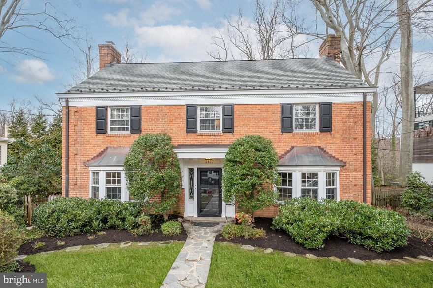 Rarely available, expansive and sunny center hall brick colonial with level entry abounds with unlimited potential.  Enjoy scenic vistas from a 9,550 sf lot on private cul-de-sac facing Rock Creek Park.  Lovely facade opens to approximately 4,700 sf of interior space boasting a wide foyer, elegant stairway, separate living and dining rooms with fireplaces, updated chef's kitchen with heated floor, breakfast bar, honed granite counter tops, stainless steel appliances, microwave -oven storage column, pantry, built-in desk and powder room.  The spacious, screened porch provides comfortable entertainment flow - kitchen to living room - and is elevated above meticulously landscaped garden with flagstone paths and patios.  Original details include "dancing foxes" copper fireplace surround, two bay window seats, dining room cabinetry, and copper and iron hardware.  The primary ensuite bedroom reveals a private deck with tree top views, marble bath with luxurious, walk-in shower, double sinks and heated floor. There are three additional bedrooms and full bath with heated floor on the second  level and two bedrooms/offices and full bath on the charming third level.  Rear walk-out provides ample space for recreational activities, a full bath, mud room and storage.  Steps to red line metro, minutes to downtown, Bethesda, airports.