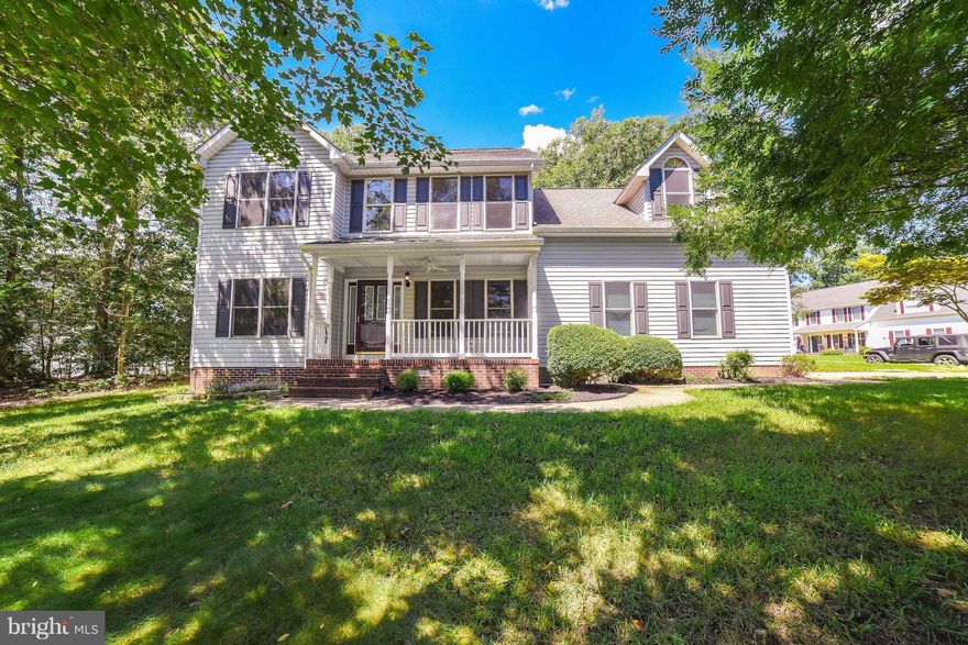 Terrific price for this delightful colonial with welcoming front porch, on a shady, private corner lot--great value for your $$! Hardwood & Duraceramic, fresh paint & NEW carpet, upgraded lighting--nice updates! KT w/granite counters, NEW stainless appliances, eating area, open to family rm w/gas fireplace. Sep DR & LR (could be office). Huge bonus rm upstairs makes great playroom or4th BR. Roomy master bedroom w/walk-in closet; nice bath has double sinks, soaking tub & shower. Mudroom, deck, 2-car garage, too! Close to schools and shopping, EASY commute to NAS PAX!