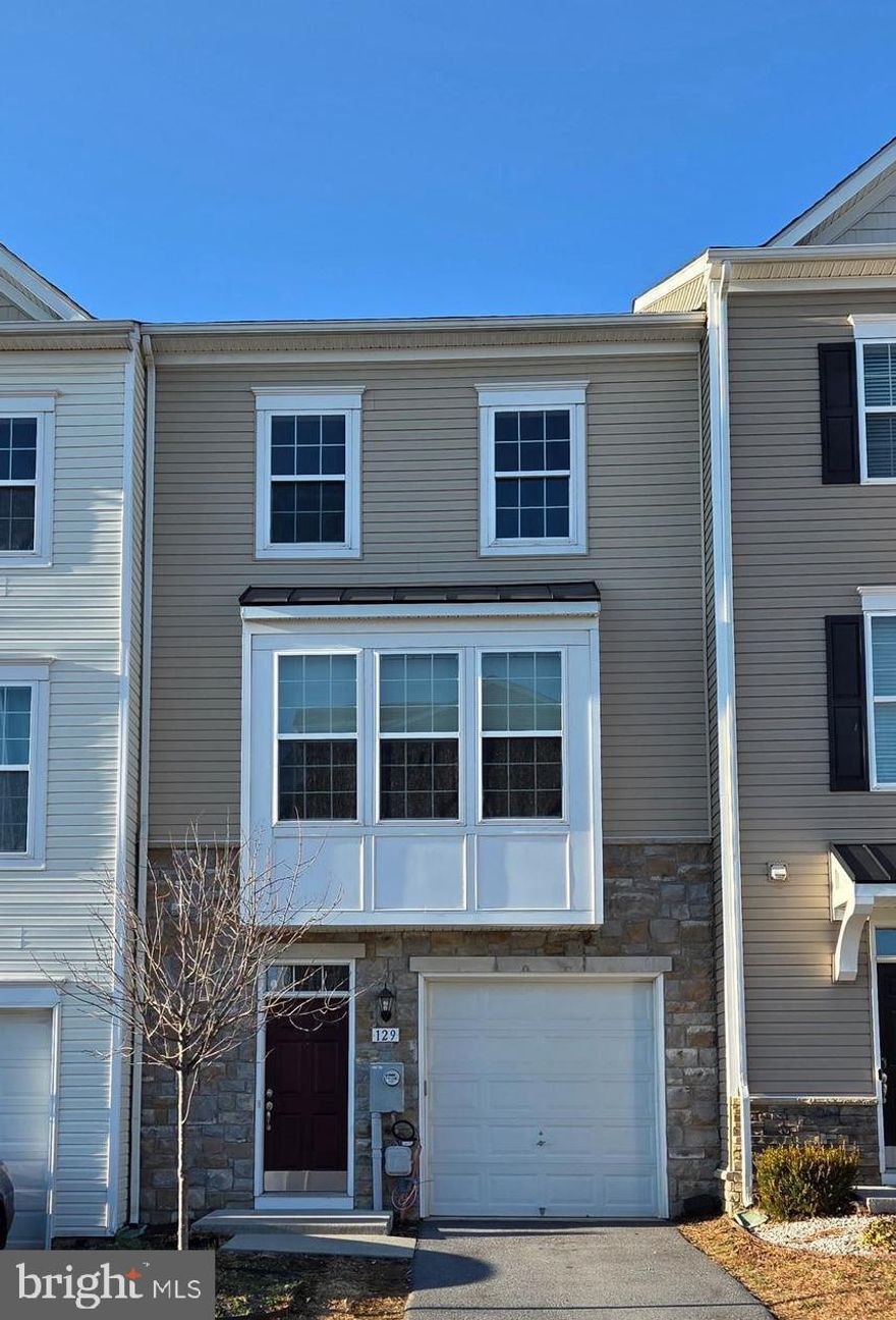 Discover the charm of this beautifully designed 3-bedroom, 2.2-bathroom townhouse in the desirable Townes of Tasker. Built in 2015, this townhome features a blend of mixed materials, including stone and vinyl siding, creating a warm and inviting exterior. Enjoy the convenience of an attached garage with a garage door opener, plus additional off-street parking. With a cozy layout, this home offers ample space for relaxation and entertaining. The well-appointed kitchen and living areas are perfect for creating lasting memories. The low-maintenance lot, just 0.05 acres, allows you to spend more time enjoying your home and less time on upkeep. Available for lease starting December 4, 2025, this property is ideal for those seeking a comfortable and modern living space. The association takes care of trash and snow removal, adding to your peace of mind. Experience the perfect blend of comfort and convenience in this lovely townhouse!