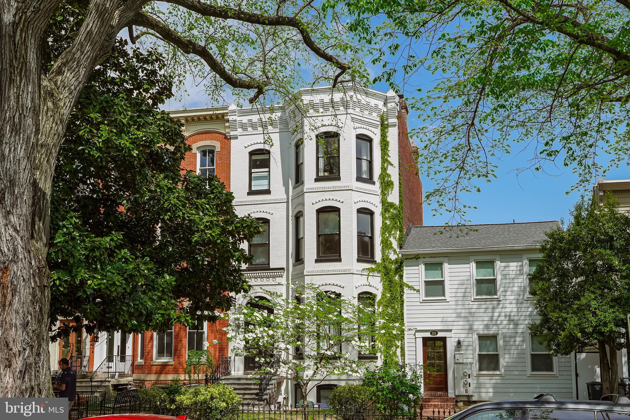 Nestled in the heart of Washington D.C.'s most prestigious neighborhood, this stately Capitol Hill residence is a testament to timeless elegance and unparalleled location. Mere steps from the iconic U.S. Capitol, this architectural masterpiece offers a rare opportunity to live at the epicenter of American power and influence.
Upon entering, you're immediately struck by the breathtaking grandeur of soaring ceilings, creating an expansive atmosphere. Pine floors, lovingly preserved, tell tales of history beneath your feet, and pocket doors reveal one stunning room after another. The expansive renovation includes a Chefs Kiss Kitchen with professional appliances, the modern flow of a waterfall stone countertop top, and a center island. Indoor-outdoor living on the wrap-around rear deck offers a seamless flow between interior opulence and al fresco charm. Whether hosting a summer soirée or enjoying a quiet morning coffee, this outdoor oasis provides the perfect backdrop.
The crown jewel of this magnificent home is undoubtedly its embassy-sized salon and dining room. These spaces, adorned with intricate crown molding and ornate medallions, are tailor-made for hosting dignitaries, political luminaries, or intimate gatherings of friends and family. Imagine the conversations and connections that will flourish within these walls!
The main house boasts four generously proportioned bedrooms, each a sanctuary of comfort and style. Three and a half newly renovated bathrooms ensure convenience for residents and guests. Crown molding throughout adds a touch of sophistication to every space.
But the surprises don't end there. The unfinished English basement, with its private entrance and half bath, will make a fantastic home office with room for staff. It offers versatile living options, perfect for long-term guests or as a potential source of rental income.
Located at the intersection of power and prestige, this property represents an extraordinary value in one of the world's most influential neighborhoods. Don't miss this once-in-a-lifetime opportunity to own a piece of history and position yourself at the heart of our nation's capital.
