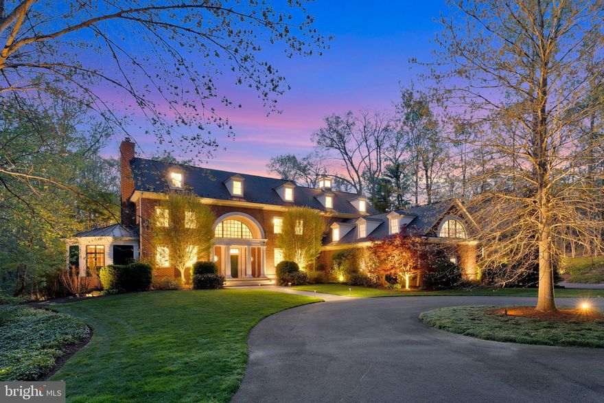 Welcome to Nuttall Oak Manor
Tucked away at the end of a quiet cul-de-sac in sought-after McLean, this exceptional estate offers privacy, craftsmanship, and convenience on five picturesque acres. Enjoy a peaceful setting with no through traffic, yet just minutes to Tysons, McLean, Great Falls, and both major airports.
Designed by Cass Associates and built by a skilled Mennonite craftsman, this 6 bedroom, 6 full and 2 half bath home showcases quality construction with steel beams, 2x6 framing, and timeless architectural detail throughout. Highlights include inset cabinetry, a custom floor-to-ceiling oak library, and extensive molding and trim work.
Each bedroom features its own en-suite bath, while the expansive primary suite occupies a private wing with fireplace, built-ins, office, sitting room, dressing area, and spa-like bath. The walk-out lower level offers a full bath, large recreation/playroom, and abundant storage.
Designed for both everyday living and entertaining, the home offers seamless indoor-outdoor flow with multiple access points to the patio, screened porch, and beautifully landscaped grounds filled with natural light and mature plantings.
The 3-car side-load garage has been thoughtfully upgraded with cabinetry, workbench space, and organization systems, along with a Tesla charging station and epoxy flooring. The driveway has been resurfaced and recently resealed.
Major system updates include a 50-year CertainTeed roof (2013), geothermal HVAC system with 5 units and 7 zones (2020), two Navien tankless water heaters (2020), and a Generac whole house generator (2021) with smart load management. Additional features include a Flo water monitoring system, 29-zone irrigation system, and circuit-level energy monitoring, all accessible via mobile app.
A rare opportunity to own a beautifully designed estate combining comfort, efficiency, and natural beauty in one of McLean’s most desirable locations.