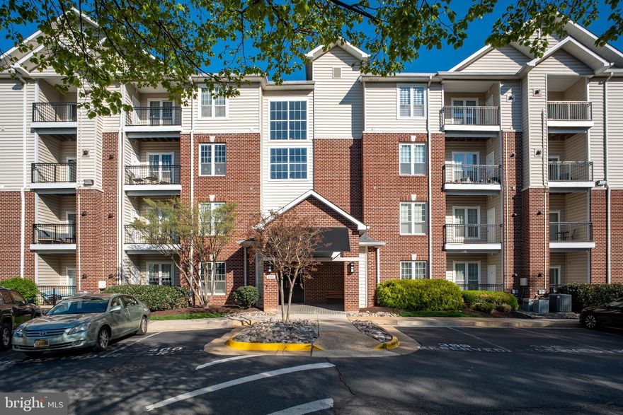 Experience the perfect combination of space and convenience in this rarely available ground-floor residence at the gated Gates of McLean! Featuring a highly desirable "roommate-style" layout, this 2-bedroom, 2-bathroom unit spans over 1,200 sq. ft.—making it one of the largest floor plans available in the community.

The Highlights:

Exceptional Outdoor Space: This unit boasts an oversized private balcony that offers a peaceful, scenic view of the lush, tree-filled courtyard. It’s a rare find that provides a seamless indoor-outdoor flow—perfect for pet owners or those who enjoy a quiet garden-like retreat.

Spacious & Open Living: The expansive living and dining area is designed for flexibility, featuring clean lines, elegant crown molding, and recessed lighting throughout.

Modern Kitchen: A gourmet galley-style kitchen featuring sleek granite countertops and stainless steel appliances.

Unbeatable Tysons Location: A true commuter’s dream! Just a short walk to the McLean Metro Station (Silver Line) and seconds from I-495, I-66, and the Dulles Toll Road. Walk across the street to Wegmans and Capital One Center or enjoy world-class shopping at Tysons Corner Center and Galleria.

Resort-Style Amenities: Enjoy secure, gated living with a clubhouse, fitness center, sauna, outdoor pool, basketball courts, and a private movie theater.

Includes assigned garage parking. Move-in ready and perfectly positioned for those seeking maximum square footage with the ease of 1st-floor, no-stairs accessibility!

Parking: Assigned parking space #400 located directly in front of the building entrance.