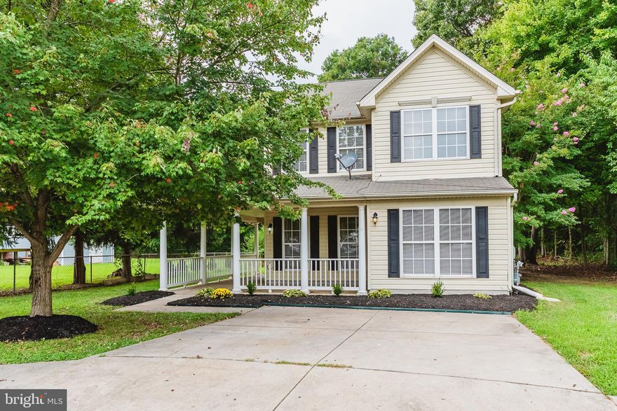 BRING YOUR ROCKING CHAIRS! THIS LOVELY COLONIAL HAS A SPACIOUS COVERED FRONT PORCH THAT WRAPS AROUND THE HOME. HOME SITS ON PRIVATE, FLAT LOT THAT BACKS TO WOODS. 3 BEDROOMS AND 2.5 BATHROOMS. LOTS OF NATURAL LIGHT. HARDWOOD IN FOYER. NEW CARPET ON STAIRS AND MAIN FLOOR. LARGE KITCHEN WITH BLACK APPLIANCES AND CERAMIC TILE FLOOR. SPACIOUS BREAKFAST AREA NEXT TO THE KITCHEN. ALL NEUTRAL THROUGHOUT.