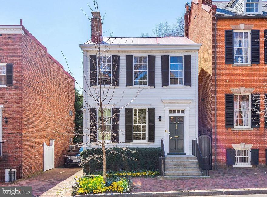 OPEN Sun. 6/2 from 2 to 4.  200K Price Reduction!  Last on the market 35 years ago, this quintessential Georgetown East Village Federal is a spectacular free standing property, beautifully preserved with many original details. The former home of American film actress Myrna Loy, it offers graceful entertaining space including a double parlor, a spacious library and charming south-facing garden with plunge pool. Newly installed top-of-the-line elevator and rare two car tandem parking. Kitchen designed by Stavropoulos Associates.  Light-filled principal rooms and charming patios, archways and gardens.