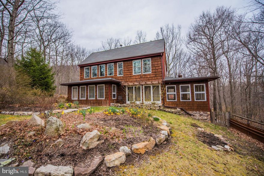 Solar Passive "envelope" style construction. See docs on line for a more detailed description. Ceramic tile noted in MRIS info is actually a type of Italian tile. Stone Landscaping, Front & back yards are fenced.  Det. garage w/ workshop area.  Shed behind det. garage w/ fenced in area, perfect for pet shelter. Remodeled kitchen & 1/2 BA.  Den/office w/ pocket doors.  Easy access to a county road.