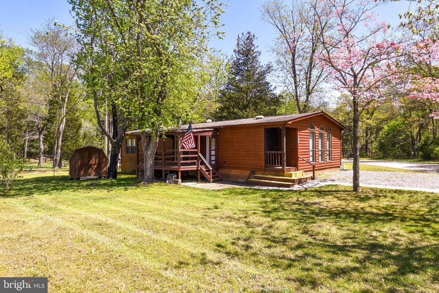 The Community (new name Cedarville Crossing) requires approval of an application. The office is open from 8-4:30 Monday thru Friday except for Holidays.  the Lease Rent which includes Water, Sewer, Lot Rent, Taxes, 2X Trash per week and Snow Removal. *** 55 and over coummunty !!Little Honey! Cute as a button 2 bedroom mobile home in lovely community, very well cared for. The master bedroom has a walk-in closet and a bathroom with a whirlpool tub. In the hallway next to the second bedroom is another full bathroom. This home features a beautiful Brick fireplace. Fantactic condition beautiful floor to ceiling windows for a bright and happy home. Great covered deck for entertaining