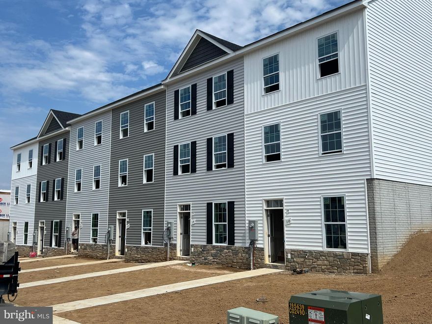 Quick Delivery! Builder offering 3% in closing costs! 3-story townhouse with 3 beds, 3.5 baths, and 1,944 sqft. Middle level features family room, kitchen, dining area, laundry room, half bath, and pantry. Upstairs has 2 primary bedrooms with en-suite bathrooms and walk-in closets. Basement includes 3rd bedroom with walk-in closet and full bath, a large rec room, and ample storage. Home has granite countertops, soft-close cabinets, LVP flooring in living area, carpet in bedrooms, walk-in shower in primary bedroom, and a walk-out basement.