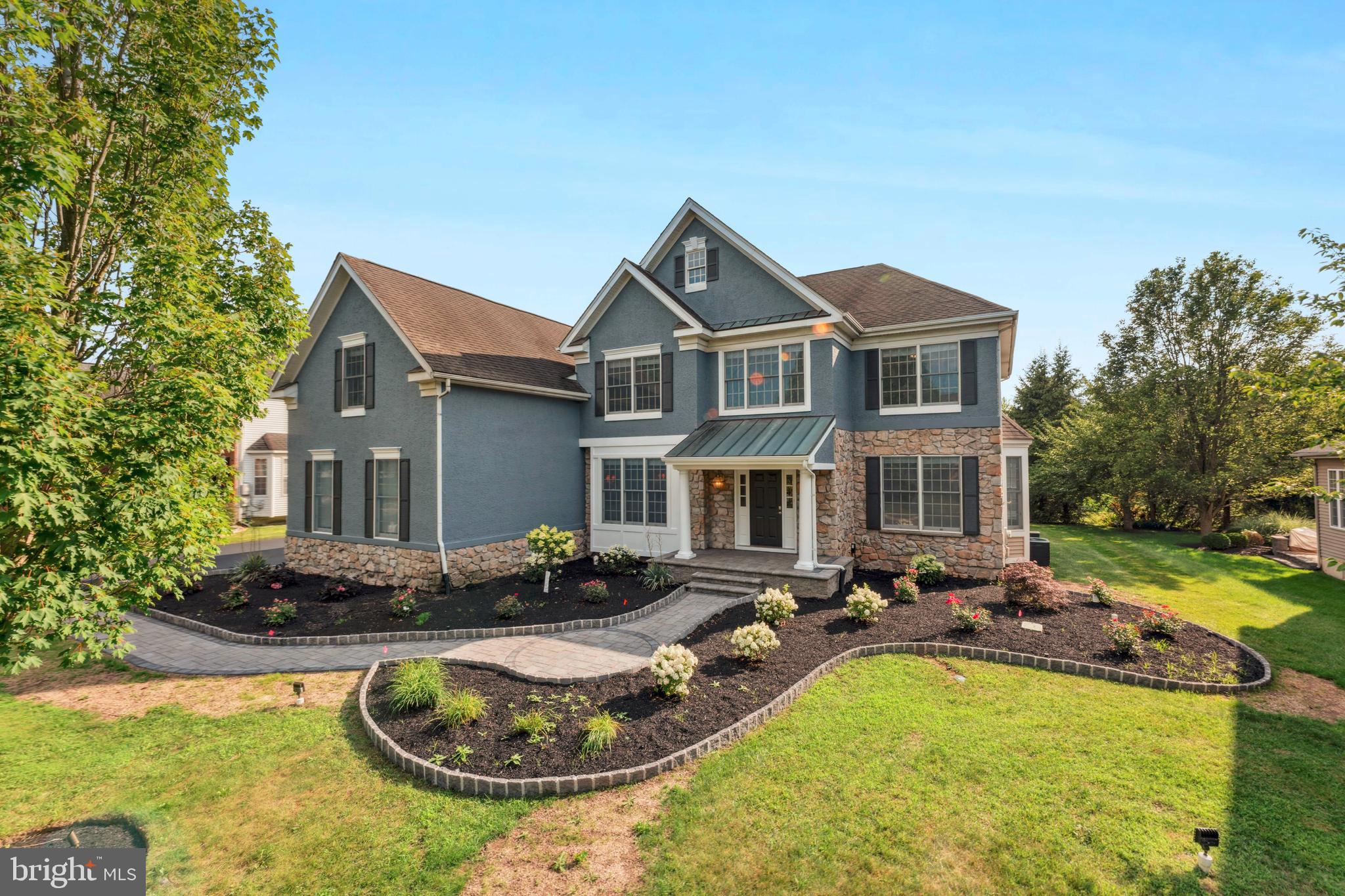 Welcome to this stunning single-family home nestled in one of Chalfont’s most sought-after communities, located within the highly acclaimed Central Bucks School District. From the moment you arrive, you'll be captivated by the home's striking curb appeal. A stately stone façade, manicured landscaping, and a charming paver walkway that leads to an inviting entrance.
Step into the grand foyer and be greeted by gleaming hardwood floors that flow seamlessly throughout the entire home. The foyer is beautifully framed by a sun-drenched sitting room on one side and a sophisticated formal dining room on the other, anchored by a graceful turned staircase that sets the tone for the elegance throughout.
At the heart of the home lies a sprawling, chef-inspired kitchen featuring an oversized island, stainless steel appliances, and an airy breakfast area with direct access to the deck. The perfect setting for morning coffee or alfresco dining with scenic views of the private backyard. The kitchen opens effortlessly into a magnificent two-story family room, where a cozy fireplace, soaring ceilings, skylights, and expansive windows bathe the space in natural light.
This level also includes a private home office, a stylish powder room, and a spacious laundry/mudroom with access to the oversized three-car garage, offering convenience and function in equal measure.
Upstairs, hardwood flooring continues throughout. Double doors lead to a luxurious primary suite complete with a private sitting area, two generous walk-in closets, and a spa-like en suite bathroom featuring dual vanities, a soaking tub, and a separate glass-enclosed shower. A well-appointed princess suite offers its own beautifully upgraded bathroom and a large closet, while two additional spacious bedrooms share a hall bathroom, also with dual vanities for ease of use. A versatile loft area with a built-in desk provides the perfect nook for homework, crafting, or a home workstation.
The finished basement expands the living space dramatically with stylish vinyl flooring throughout. This level includes a powder room, a walk-up to the backyard, and a sizable unfinished area ideal for storage, a gym, or future customization. Whether entertaining guests or hosting game nights, this space offers endless potential.
Out back, the home offers a serene, private oasis, ideal for summer barbecues, backyard games, or simply relaxing with loved ones. Mature trees and thoughtful landscaping create a quiet retreat that’s perfect for all seasons.
With 4 spacious bedrooms, 3 full and 2 half bathrooms, generous living and entertaining spaces, and a prime location in the desirable Central Bucks School District, this home is truly the complete package. Don’t miss this incredible opportunity to own a residence where luxury, comfort, and functionality come together in perfect harmony.