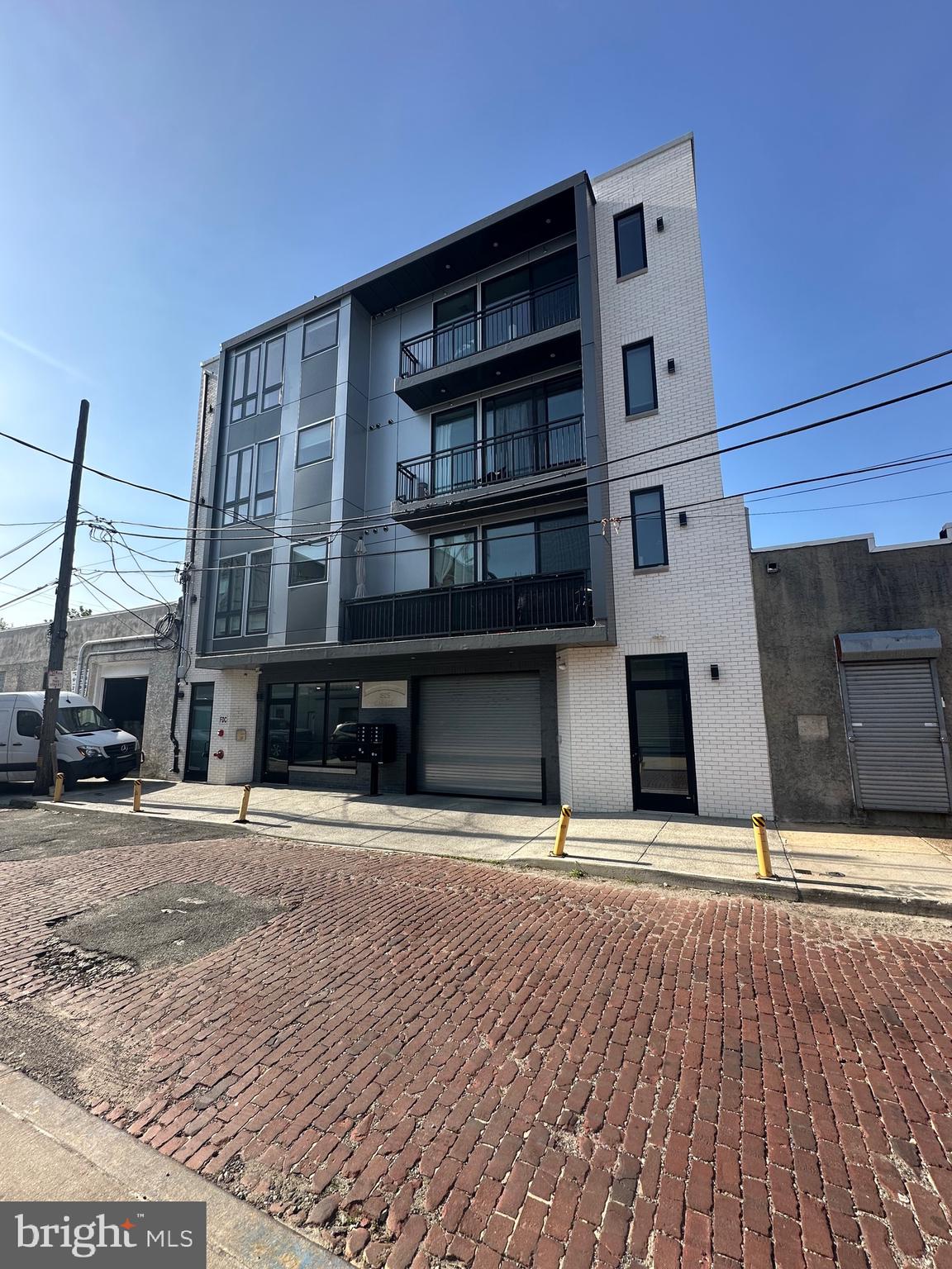 Beautiful 2 year old 6 unit apartment building with garage parking for 4 cars available for sale now! In one of the most desirable neighborhoods in South Philadelphia this property has 6 one bedroom/one bath apartments with quartz countertops, extra large showers, stainless steel appliances, walk in closets, and a washer and dryer in every unit. Apartment 2 has it's own balcony the entire length of the apartment! The others have sliders out to their smaller balconies and all can enjoy the spacious rooftop deck! There is parking for 4 cars on the first floor and this building has an elevator! There is also low maintenance vinyl plank flooring throughout-nothing was forgotten at this special property perfect for a 1031 exchange. There is about 8 years left on a tax abatement as well. Tenants have been paying $1800 a month plus $200 for parking for 2 years with zero vacancy so there is definitely room for rent increases.