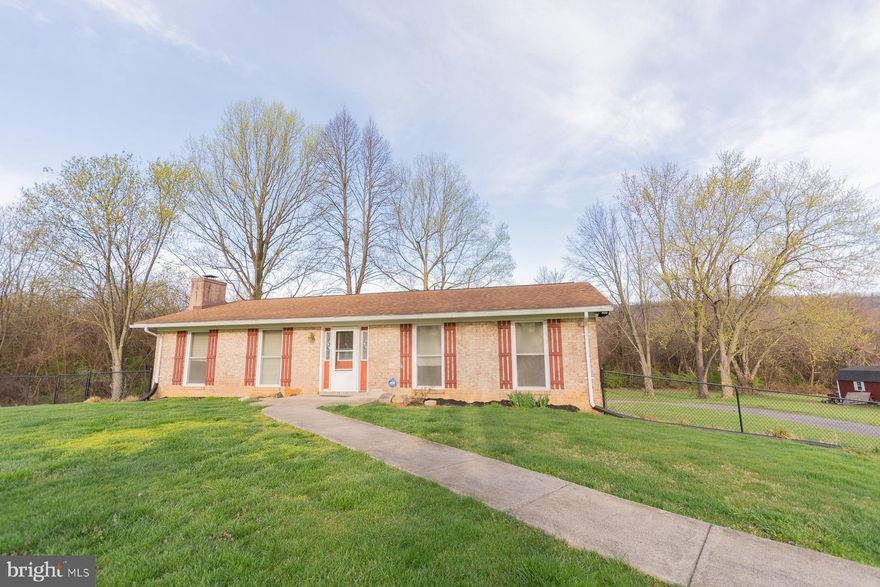 Public Open House - Sunday, 6/2/24 from 1:00 p.m. to 3:00 p.m. 
Travella Cook with Supreme Lending will be on site for financial questions.  
Welcome to this stunning all-brick ranch boasts the perfect blend of comfort and charm, nestled on an unrestricted one-acre lot with breathtaking mountain views. It’s been freshly painted.  With 3 bedrooms and 2 full baths, this home offers space and serenity. The spacious living room is bathed in natural light.  Prepare to be impressed by the well-appointed kitchen, complete with modern appliances and ample counter space for all your culinary adventures. Adjacent to the kitchen, the dining area offers a warm and inviting space to enjoy meals together.  Outside, is the oversized deck and fire pit.  The chain-link fencing provides privacy and security, while the partially finished basement offers endless possibilities for expansion or storage.  But the true highlight of this home? The stunning mountain views.  Privacy abounds with orchard trees lining the backside of the property, creating a serene backdrop for your daily adventures.  Conveniently located just minutes from I-81, this home offers easy access to schools, shopping, dining and hospital, while still providing the peace and tranquility of country life.  Don't miss your chance to experience the beauty and serenity of this incredible property—schedule your showing today and make your dream home a reality!