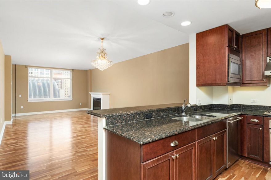 Welcome home to 440 S Broad St #1003. This extraordinary condo is located right on South Broad Street, the Avenue of the Arts, in the desirable Symphony House Condos. Complete with an open floor plan and beautiful panoramic views of the city, with a balcony that points directly over the Kimmel Center towards City Hall, this condo is a must-see! This 1-bedroom 1-bath condo is very spacious with a large living/dining room complete with a fireplace and a large balcony. In the kitchen, you will find stainless steel GE Monogram appliances with a Viking rangehood.  The kitchen also has a breakfast bar and a pantry for extra storage. The bathroom is complete with both a bathtub and a stall shower, and the unit has a stackable washer and dryer in the adjacent closet. The bedroom is large and has its own walk-in closet. This unit does come with an owned reserved parking spot, which is separately deeded to the property. It is located on the roof of the parking garage, and the parking spot is #656. This is a great bonus being sold with the unit. Make your appointment today, you will be glad you did. Please take note of the amenities that are on site, which we have featured in our photos. These include an indoor pool and hot tub, sauna, massage room, gym, meeting room, media room,  wine cellar, and additional large exterior balconies.