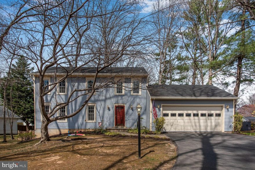 Discover this charming and well-maintained five-bedroom colonial, perfectly situated at the end of a cul-de-sac in the heart of sought-after Burke Centre! This home is warm and inviting with a traditional yet functional floor plan. The main level features new hardwood floors in the living room (2022), the family room is a cozy retreat with an oversized window, built-in bookshelves and a wood burning fireplace. The kitchen is both stylish and practical, accented with glass-front cabinets, granite countertops, stainless steel appliances (dishwasher 2023), and an eat-in area that flows seamlessly to the spacious deck—perfect for barbecuing and entertaining. The spacious living room offers versatility to fit your lifestyle, while the dining room sits perfectly adjacent to the kitchen for effortless entertaining.

Upstairs, the oversized primary bedroom has a spacious walk-in closet and so much potential for customization. Three additional bedrooms and an updated hall bathroom complete the upper level. The finished lower level (2022) adds incredible versatility with a fifth bedroom, full bathroom, recreation space, office/gym area, and additional storage. Wow! 

This home has been meticulously maintained, with recent updates including a new HVAC system (2022), water heater (2024), and 6” gutter replacement (2021). The freshly painted two-car garage provides both convenience and extra storage. This home is close to woods, jogging paths, tot lots, swimming pools, tennis & basketball courts, and community centers. With easy access to major transportation routes, VRE, GMU, NVCC, and fantastic shopping & dining, this is one you don’t want to miss!