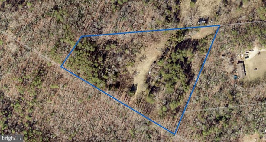 Check out this level 5 acre lot on Tasha lane. Less than ten minutes to all major shopping and highways! Shallow well on property, electric nearby, and septic possible (buyer to verify all info). Quiet driveway leads you to the back for your own section of wooded bliss. Bring your builder and come check it out!