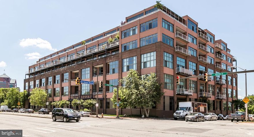 Chic urban loft in waterfront building at the harbor's edge.  This impressive and spacious two-level residence in Canton Cove Condominium boasts an open floor plan with 1,345 sq. ft. of premier living space.   Features on the first level include:  an inviting foyer,  dramatic great room with 18' ceilings, significant wall of windows and access to a private balcony.  There is a separate dining area, which could be converted to a second bedroom, newly renovated sleek kitchen with stainless steel appliances, wood cabinetry, and solid surface countertops,  maple hardwood flooring,  custom window shades, full bath, separate laundry area, and large pantry/closet.  The second level loft consists of the en-suite bedroom,  bath, and a large walk-in closet.  The adjustable windows can be closed and the designer blinds drawn to create privacy in the loft bedroom. The condo is enhanced with a neutral paint pallet, designer accent lighting, and good closet space.  One assigned exterior parking space conveys.  Building amenities include 24 hr. front desk coverage and security,  Gas and water usage as well as basic cable service are included in the condo fee.  The water-front condominium complex is located in historic Canton and is an easy walk to Canton Crossing, "The Square", restaurants, bars, and parks.  Within close proximity are Downtown Baltimore, Harbor East, Johns Hopkins and other hospitals, institutions, and major highways.