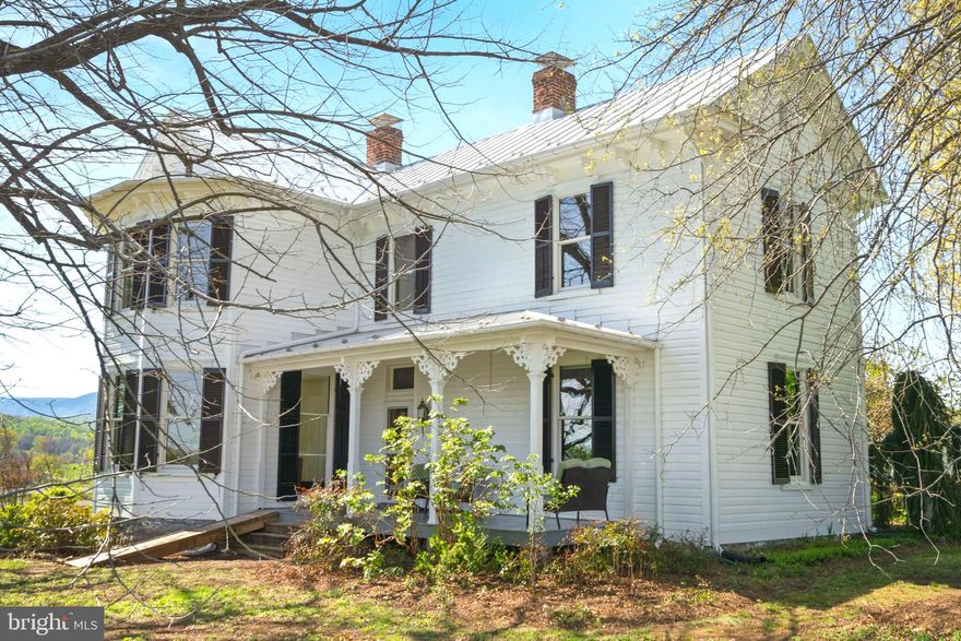 A Once in a Lifetime Opportunity to Own an Enchanting Historic Country Retreat in Rappahannock County with Spectacular 360-degree Mountain Views of Skyline Drive and Old Rag! Built circa 1900 by master builder George Hawkins and known as “The Starke House,” the home is situated on nearly 10 acres of picturesque gently rolling land. Nestled in the town of Woodville, Virginia, this historic residence offers a unique blend of classic charm and modern comfort. 
Heart pine wood floors and high ceilings throughout enhance the warm, open and inviting atmosphere with an updated country kitchen—a culinary dream featuring granite countertops, an island with bar seating and gas cooktop, gourmet appliances, and a bay window view of Old Rag. 
The original front door, adorned with stained glass details, leads to a spacious welcoming front porch. Updated kitchen and bathrooms blend seamlessly with the home’s character. The spacious owner’s suite offers a luxurious retreat and boasts an ensuite bathroom with a footed soaking tub also with breathtaking views. 
The property also features a versatile small outbuilding, ideal as an office, playhouse or gardener’s space and is alongside a classic 1900s barn. 
Meticulously maintained, the home showcases new Andersen windows, a new metal roof and new HVAC systems. Freshly painted inside and out, the property’s quality construction remains evident in its soundness and intricate woodwork. Original architectural details reflect the home’s rich history. Additionally, a studio cottage built in 2000 on a separate 2-acre lot (included in the 9.54-acre sale) offers immense potential. With panoramic mountain views, this structure could be transformed into an amazing guest house, artist or writer’s studio, utilized as a separate rental, or sold as a distinct parcel with its deeded access from Hawlin Rd. Less than five miles from Sperryville, ten miles from the Inn at Little Washington, and ten miles to Shenandoah National Park this home is close to excellent restaurants and charming shops, blending rural tranquility with convenient access to local amenities. Accessible to Dulles and Charlottesville airports. High speed internet makes this a perfect space for remote work. 
This property offers a unique opportunity to own a piece of history in a serene and sought-after location. Whether you are looking for a weekend retreat or a full-time residence, 873 Hawlin Road provides the perfect setting to enjoy the beauty and tranquility of the Blue Ridge Mountains and Rappahannock County, Virginia. Embrace this rare opportunity to own a piece of history and a welcoming home.

ACCEPTING BACK UP OFFERS