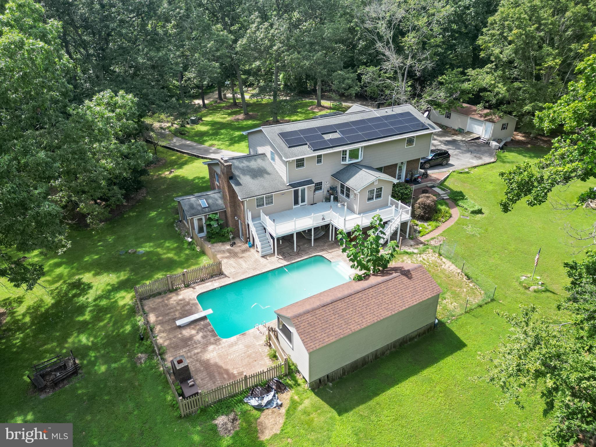 Private Waterfront Estate with Two Homes, Pool, and Scenic Views – A True Countryside Retreat
Tucked away at the end of a private road on 3 acres, this peaceful and secluded retreat offers the ultimate in country living with spectacular views of Indian Creek and an abundance of space for multi-generational living, entertaining, and outdoor recreation.
The main residence features 6 bedrooms and 4.5 bathrooms, thoughtfully designed for comfort and function. Complementing the main home is a separate 2-bedroom, 2-bath guest house, renovated to include roof, siding, updated kitchen and bathrooms, —ideal for in-laws, a home office, or as a rental income opportunity with separate electric metering. Both homes operate with separate septic systems and independent wells.
Enjoy the expansive country kitchen, outfitted with stainless steel appliances, abundant cabinetry with pull-out drawers, and ample counter space for gatherings. Relax in one of two primary suites, each offering soaking tubs, separate showers, and serene views.
Outdoors, the property is a true oasis. Launch your kayaks, canoes, or jet skis from your private pier and take in the breathtaking natural surroundings. Or unwind poolside with a dip in the fenced-in in-ground pool, complete with a screened 12x40 pool house for shaded comfort.
Additional features include:
Two 14x40 Amish-built sheds, one with electricity
Custom chicken coop
Heated floors and 3-zone baseboard hot water heating
Full laundry room with oversized utility sink
Pellet stove and two wood-burning stoves for cozy winter nights
Generator hookup for whole-home backup power
Large metal patio deck and welcoming front porch
Custom-built children’s playground and playhouse
Solar panels will be paid off at the time of settlement
Whether you're watching wildlife from the porch, enjoying a summer afternoon by the pool, or spending quality time indoors with family, this one-of-a-kind property offers a rare opportunity to live your dream lifestyle.