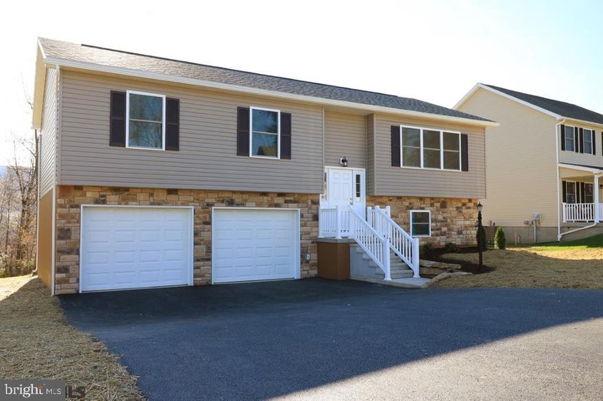 New construction in the desirable Stonehouse Development! Be the first owner of this lovely 4 bedroom, 3 full bath, open concept home. The main level includes a large living room/dining room area, open to a custom kitchen with white shaker style cabinetry, soft close drawers, granite countertops, SS Appliances and luxury vinyl plank flooring throughout entire house. Also on the main level you will find an owner's suite with private bath, two additional bedrooms and full bathroom. The lower level delights with an expansive family room, laundry room, full bathroom and an additional bedroom. Enjoy entertaining on the 14X9 deck on a quiet, flat .62 acre lot overlooking beautiful mountain views. Easy access to State College, PSU, Lock Haven, Bellefonte, I-80 and conveniently located to State Parks and trout steam. Still time to make some selections. Home will be completed for you by the end of August! This is Lot 18.