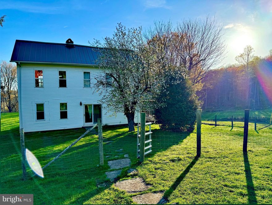 "Farm House on 100 ACRES" Tucked in the Mountains of West Virginia, this newly renovated farm house on a horse farm is accompanied by panoramic views in all directions & FREE GAS! Enjoy sunsets from the new hot tub & sunrises on the newly added screened in porch with gas hookup. This property has a mix of mature hardwoods, ponds, and beautiful meadows. The farm house features a new metal roof, upgraded 200 amp underground service w/ generator & RV hookup, radiant floor heat with baseboard, partially insulated floor, remodeled gas log/ ventless fireplace, new well pump, new floors in kitchen, living room, & primary bedroom, and whole house cell phone booster for upgraded signal. The barn has an added horse stall and additional lean-to on side. Electric horse tape borders whole property. Deer, turkey, & bear also call this property home and make for excellent hunting or nature watching. Chicken coop and multiple outbuildings for storage. Great road system through the whole property makes for easy access. Views of the Tygart River from the back meadow. Call for your Private Showing today!