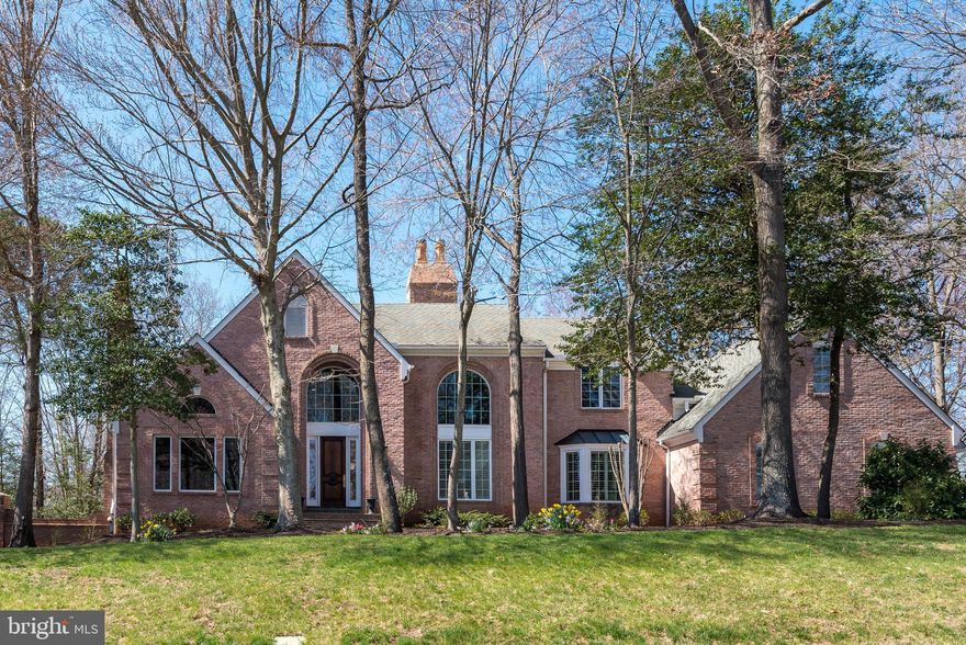 Custom 4-sided brick, luxury estate in desirable Hannah Hills is fabulous inside and out!  Expertly crafted with exquisite attention to detail by Scott Cronacher Estates this elegant home is a masterpiece.  From the stately curb appeal to the dramatic soaring ceilings, you will be awed with the timeless design and thoughtful details that make this lovely property a work of art.  Featuring custom trim, intricate millwork, hand carved fireplace mantels, walls of windows, and a smartly designed floorplan that provides every bedroom with an en suite bath, this classic home is sure to please.  Impressive quality finishes include extensive use of marble and granite, hardwood flooring, high end appliances and quality fixtures.    The massive deck and lower level patio make for perfect outdoor entertaining space.  Beautifully sited on a premium, quiet cul-de-sac lot, the treed lot is almost an acre,  and can accommodate a pool.  This home is perfectly suited for multi-generational living with a main floor primary suite, 2 upper level suites, plus two upper level bedrooms that share a buddy bath, and a lower level full egress au pair or in-law suite.  This gracious home has everything you want on your wish list - main level library,  lower level walk out with home gym, huge rec room with wet bar, extensive storage space, a gardening room and a 3 car garage, all in a fantastic, tree lined neighborhood with excellent schools - Oakton Elementary, Thoreaus Middle, Madison HS.  You will be enchanted by the beautiful details and impressed with the quality of this truly spectacular home!  Put this gracious home on your MUST SEE list!  *Offers will be reviewed Monday at noon.