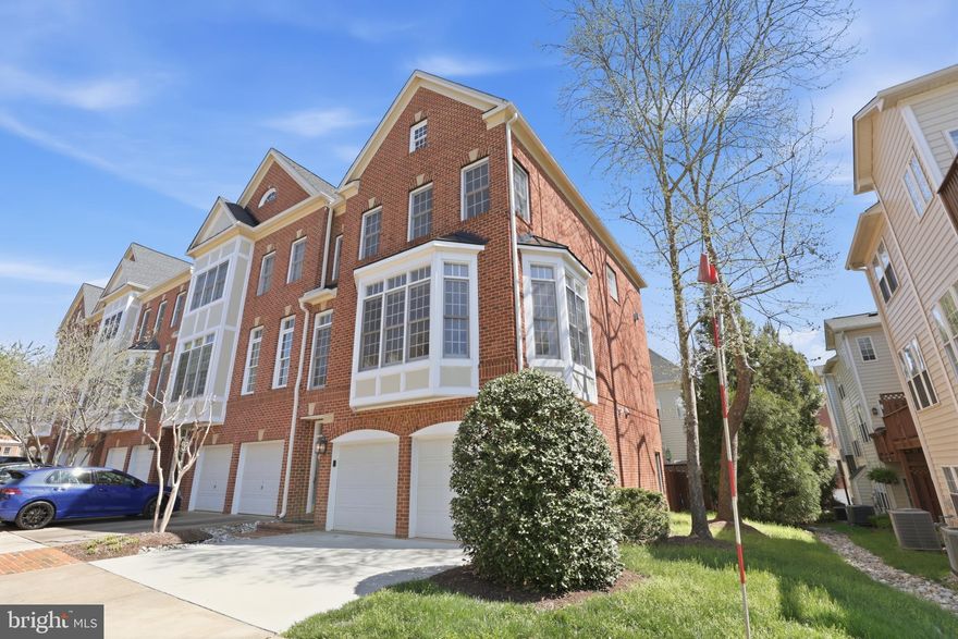 Former model home in sought-after Medinah Homes at Lowes Island. Rare end-unit with a grandfathered fenced yard—unique within the community—paired with low-maintenance condo living including exterior care, roof, and master insurance. Bright, open floor plan with walls of windows throughout. Main level features a gourmet kitchen with butler’s pantry, breakfast area, and formal living and dining spaces with gas fireplace and custom built-ins. Upper level offers a spacious primary suite with tray ceiling, bay window, fireplace, walk-in closet, and updated spa bath, plus two additional bedrooms. Walk-out lower level with full bath, large windows, and access to a private slate patio and fenced yard. Two-car garage, ample storage, two-zone HVAC, and major system updates. Enjoy Cascades amenities including 5 pools, fitness centers, tennis, pickleball, and trails. Convenient to shopping, Reston Metro, Dulles Airport, Route 7, and Fairfax County Parkway. Open House: Saturday, April 11, 1-3pm.