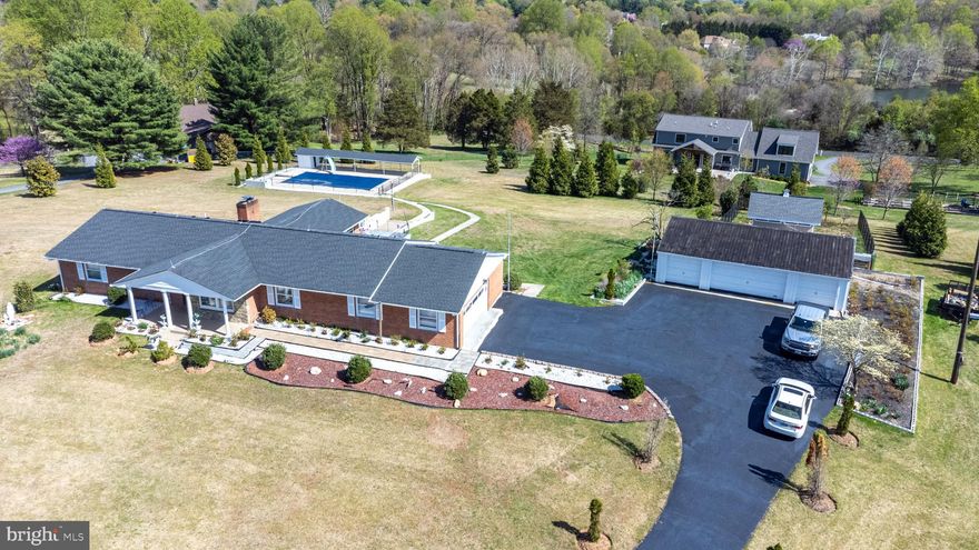 Welcome to this beautifully updated home set on over 3 acres, offering stunning scenic views on a peaceful setting.   Nestled in a sought-after community, this property combines space, comfort, and modern updates. The home features a spacious layout with thoughtful upgrades throughout.  Enjoy the convenience of an attached 2-car garage, along with a detached 3-car garage-ideal for car enthusiasts, a workshop, or additional storage.  Surrounded by natural beauty and located in a picturesque neighborhood,