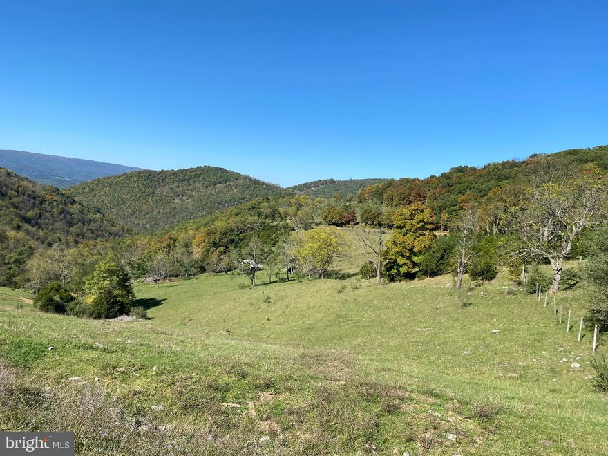 Located atop Patterson Creek Mountain, this old mountain top farm of rolling fields and woodland, with views to the Alleghenies to the west and South Branch Mountain to the east,  is truly one of the most picturesque areas around. Fenced and partially cross-fenced and presently leased for pasture, it has an old house on it that is most likely past restoration. It has a decent spring or two, a small stream and the ridge top would be perfect for a windmill to generate your power! If off-grid homesteading is what you're searching for,  this is the one! Located in Grant county on the Hardy/Grant County line, it is unrestricted and the possibilities are endless for what you could do here. Within a half hour of river access/shopping/medical in progressive Moorefield, and an hour to Davis for skiing and outdoor recreation, this location is perfectly situated on a low-traffic county road with lots of privacy! There is even an old quarry on the property for your convenience to build interior roads. A right of way has been obtained for electric. Views for miles from numerous building sites make this an entrepreneur's dream for building tiny house off-grid rentals, etc.  Also perfect for the local farmer looking for more pasture (approximately 200 acres), as you know how hard THAT is to come by! Locked gate - must be accompanied by agent.  Selling "AS IS"