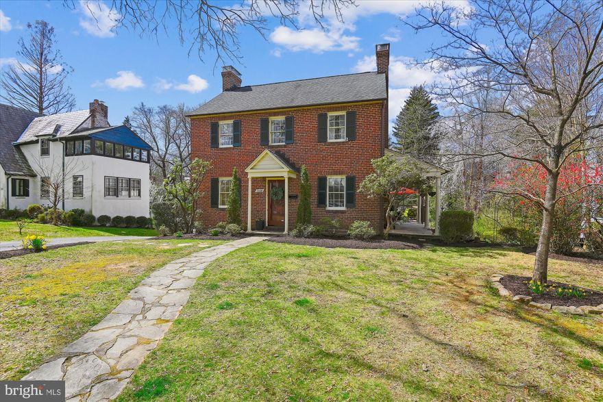 Large, brick colonial in Historic Stoneleigh. Located in the heart of the neighborhood; only a  short walk to the Stoneleigh Pool and Stoneleigh Elementary School.  This home maintains it's historic charm while incorporating a floor plan for todays living. The main floor has abundant living space with high ceilings and pristine hardwood floors throughout. The large dining room is located to the left of the foyer and the spacious formal living room is to the right.  There is access to the stunning great room and kitchen through both the living and dining rooms. The expansive great room features cathedral ceilings and abundant natural light which pours in through the Palladian  window and 4 panel glass sliders which access the deck.  There is an additional glass door which provides easy access to the side deck and  sweet, flag stone, covered porch. The kitchen is open to the great room and features white cabinetry, black granite counters and stainless appliances. Off the kitchen there is a hallway with a half bath, pantry and entrance to the basement staircase. The second level has three bedrooms and two full baths which feature classic black and white ceramic tile. The primary bedroom has two closets and an attached bath with stall shower. The hall bath has a bathtub with shower and classic sink with chrome legs.  There is a linen closet located in the second floor hallway. The third level is accessed through a staircase in the second bedroom. The third floor is home to the 4th bedroom. It is carpeted and has built-in storage and  extra space for a study area or den. The basement level has a cozy rec room with wall to wall Berber style carpet and recessed lighting,  a work room/utility/ laundry room and a massive unfinished area which is heated and has an exterior door to access the back yard. This unfinished space is mostly above grade and is the perfect space for a future in -law suite, large home office, game room or home theatre. See virtual floorplan. Offer deadline of Monday 3/25 at 10:00 am
