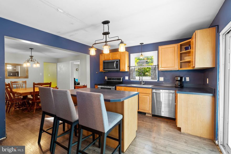 Sellers are offering $5,000 in concessions to help make this home yours! This property qualifies for a renovation loan, giving buyers the opportunity to complete updates before closing and add instant value. Bring your vision and make this spacious 5-bedroom home your own. Blending historic charm with modern comfort, this Jefferson County gem sits on a generous .71-acre lot and offers room to grow both inside and out. The property includes a chicken coop, run, and raised garden beds, perfect for anyone eager to embrace a homestead lifestyle. An oversized two-car garage provides ample space for parking, storage, or hobbies. Inside, the home features an inviting informal living area that opens to a screened-in deck, a main-level primary suite for convenient single-level living, and a first-floor laundry with a newer washer and dryer. The kitchen, complete with an island, newer refrigerator, and open flow to the dining room, is ideal for entertaining. Flexible spaces throughout the home adapt to your needs. Work from the office near the newer top-of-the-line pellet stove, unwind in the cozy sitting room off the kitchen, or step out onto the spacious deck to enjoy the yard. A large finished bonus room above the garage and a main-level flex room offer even more possibilities for recreation, work, or play. Upstairs, you’ll find four additional bedrooms, a full bath, and charming original built-ins that showcase the home’s character. Recent updates include replacement windows with a transferable lifetime warranty and two newer HVAC units, providing comfort and peace of mind. While several projects remain, many major improvements have already been completed, leaving the perfect opportunity to finish and personalize this unique home. Don’t miss your chance to own a one-of-a-kind property brimming with space, history, and potential.