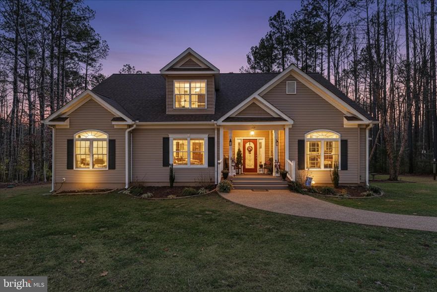 Lake Life in the country, what more could one ask?!  This beautiful home offers 3591 square feet of living space, sited on 4.98 acres, with a deeded boat slip, on the private side of Lake Anna.  The coveted community of “The Waters” has abundant amenities including a pool, boat launch, covered picnic areas, marina, club house, beach area, tennis/pickle/basketball and playground. With fresh neutral paint, this home is move-in ready!  The main level is open concept, with 9-foot ceilings, hardwood floors, and upgraded millwork.  The kitchen features a spacious island, granite counter tops, stainless steel gas range and opens to dining, screened porch, family room area and deck access.  There are three main level bedrooms including the owner’s suite with 2 walk-in closets. The primary bath has a soaking tub, stall shower, two vanities and a water closet.  
The upper level has bamboo flooring, a designated area for the 4th bedroom, a full bath, entertainment area and a spacious recreation room.  There is a utility area with a sink that could be a kitchenette or wet bar.  
This home has been built, maintained and improved with the highest standards in mind including a new roof, new heat pump, solar, and a whole house generator!