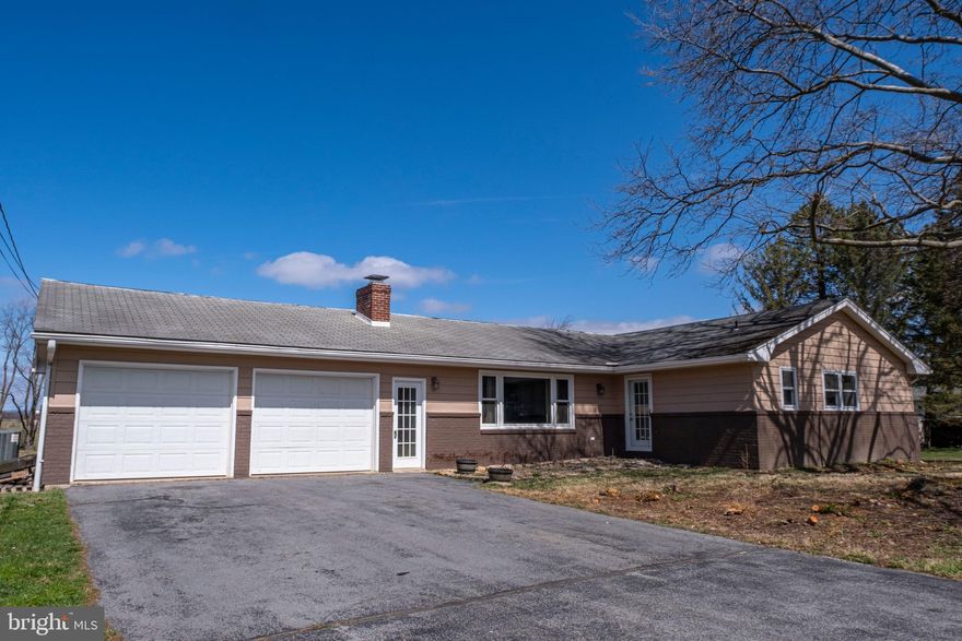 Nestled on 1.7 scenic acres in the heart of Pennsylvania Furnace, this spacious ranch-style home offers comfort, convenience, and endless potential. The large eat-in kitchen is perfect for gathering, while the expansive great room provides a warm and inviting space for entertaining. A second living room offers additional flexibility for relaxation or a home office. The owner’s ensuite is a private retreat, complemented by two additional baths to accommodate family or guests. The lower level features a small finished space, ideal for a cozy den or workout area, along with a large unfinished area, perfect for storage or future expansion. Outside, enjoy the peaceful setting, ample yard space, and the convenience of a 2-car garage. This home is a fantastic opportunity to create your dream space in a beautiful location.