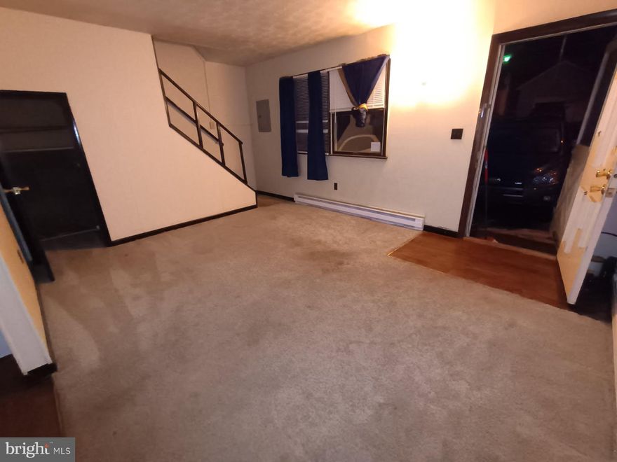 Two bedroom, one bath apartment with ground floor entry, and off street parking.