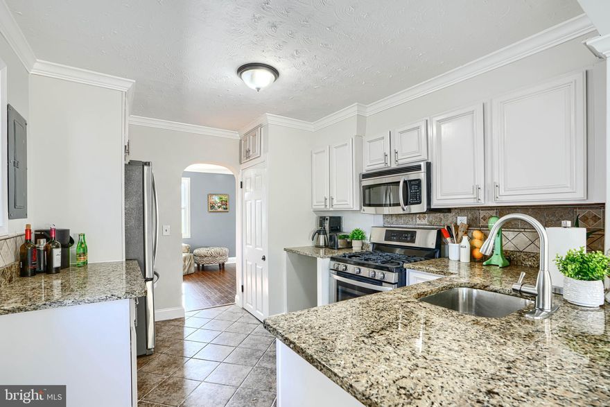 Welcome to 25 Crafton Rd! This beautifully updated 3bed/2 bath home perfectly blends classic charm with modern comfort. The bright, open floor plan features recessed lighting, abundant natural light, and a seamless flow from the living room to the modern kitchen with granite countertops, stainless steel appliances, and a breakfast bar. The spacious family room impresses with skylights, tile flooring, and an electric fireplace, while sliding doors open to a fenced backyard—ideal for entertaining or relaxing. The main level includes the primary suite and full bath, with an additional bedroom, bath, and bonus room upstairs perfect for a home office or gym. Conveniently located near shopping, dining, and commuter routes, this move-in ready home is a must-see! *$30,000 swim spa hot tub to convey with the sale for an additional $10,000*