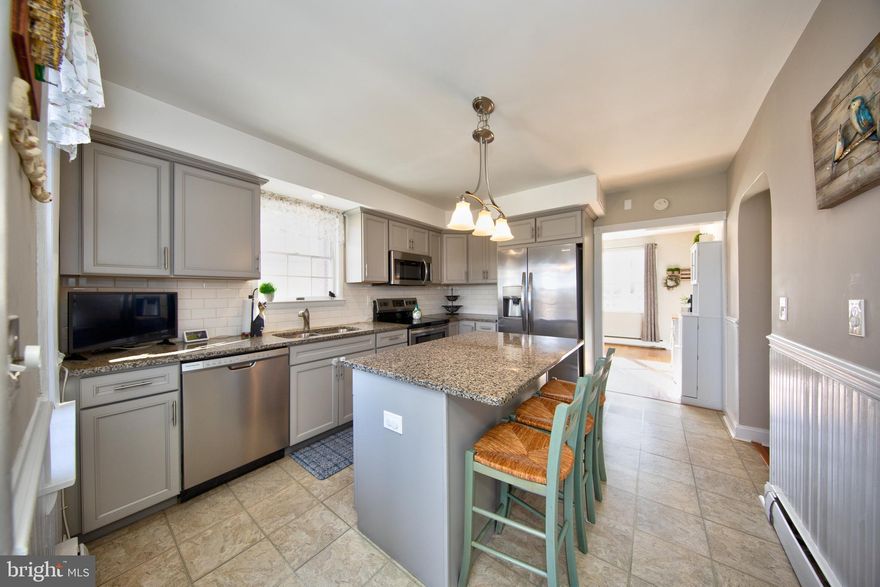 WELCOME HOME to this BEAUTIFULLY RENOVATED ALL BRICK, 3 Bedroom Cape Cod located in a Sought-after Essex Community.  Sellers have taken pride in this Gorgeous Home and it shows! You'll fall in Love with the Stunning  kitchen w/ Granite counters,  Spacious Island with seating, Stainless appliances, Attractive Subway tile & Wainscoting;  BRIGHT and SPACIOUS  Rooms throughout with  Bay windows in Dining Room and  Living Room!  Wood-burning Stone fireplace in Living Room, Wonderfully Finished  Lower level includes a Brick Fireplace with wood stove insert (As-is)  and  there is tons of storage! There is also a 3rd toilet with potential for an additional full bath! Cozy screened-In porch off the kitchen leads to concrete patio and a Huge fenced rear yard with storage shed, a few mature trees & landscaping,  Don't miss out,  MUST SEE INSIDE! You'll LOVE it!