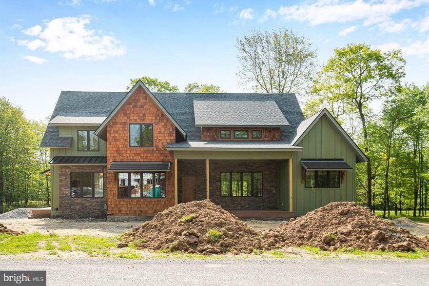 New construction home located in the beautiful Lago Vista subdivision atop Wisp Mountain. This home will offer seven bedrooms, four and a half baths, three levels of living space, an open floor plan, office, a bonus room/potential extra bedroom and an attached 3-car garage. The cathedral ceilings, abundance of windows and beamed ceilings will truly make this home a masterpiece from the moment you walk in. The LP Smart siding with some cedar shake and stone accents also add to the charm and character of this mountaintop home. The location is another plus, just minutes to Wisp Ski Resort, walking distance to Lodestone Golf Course and a short drive to Deep Creek Lake. Once this masterpiece is complete, it will be sure to check off all the boxes on your wish list for a dream mountain home.