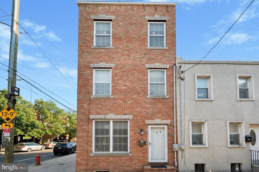 Check out this move-in ready brick end-of-row townhome in the heart of Pennsport! Built in 2012, this newer home offers a blend of comfort, style, and city convenience. Out front, the classic brick exterior adds timeless charm, and being the end unit gives you extra privacy and sunlight. Step inside to a bright, open layout on the main floor. The living room features hardwood floors and a ceiling fan, leading through a dining space into the eat-in kitchen. Here, you'll find granite countertops, stainless steel appliances, a breakfast bar, and plenty of cabinet space. A convenient powder room and access to your own private back patio complete this level. The second floor includes two generously sized bedrooms, a full hall bathroom with a tub-shower combo and wide vanity, plus a laundry room with counter space and cabinets for easy organization. The top floor is your spacious primary suite. Enjoy a large walk-in closet, a full ensuite bathroom with a tub-shower combo and dual vanity, and best of all, direct access to a rear-facing roof deck. The finished basement adds even more living space, perfect for a home office, gym, or media room. On-street parking is available, and with two private outdoor spaces, you’ll have plenty of room to relax or entertain — a true bonus in city living! Plus, you'll love the easy access to major highways, shopping, restaurants, and everything Pennsport has to offer.