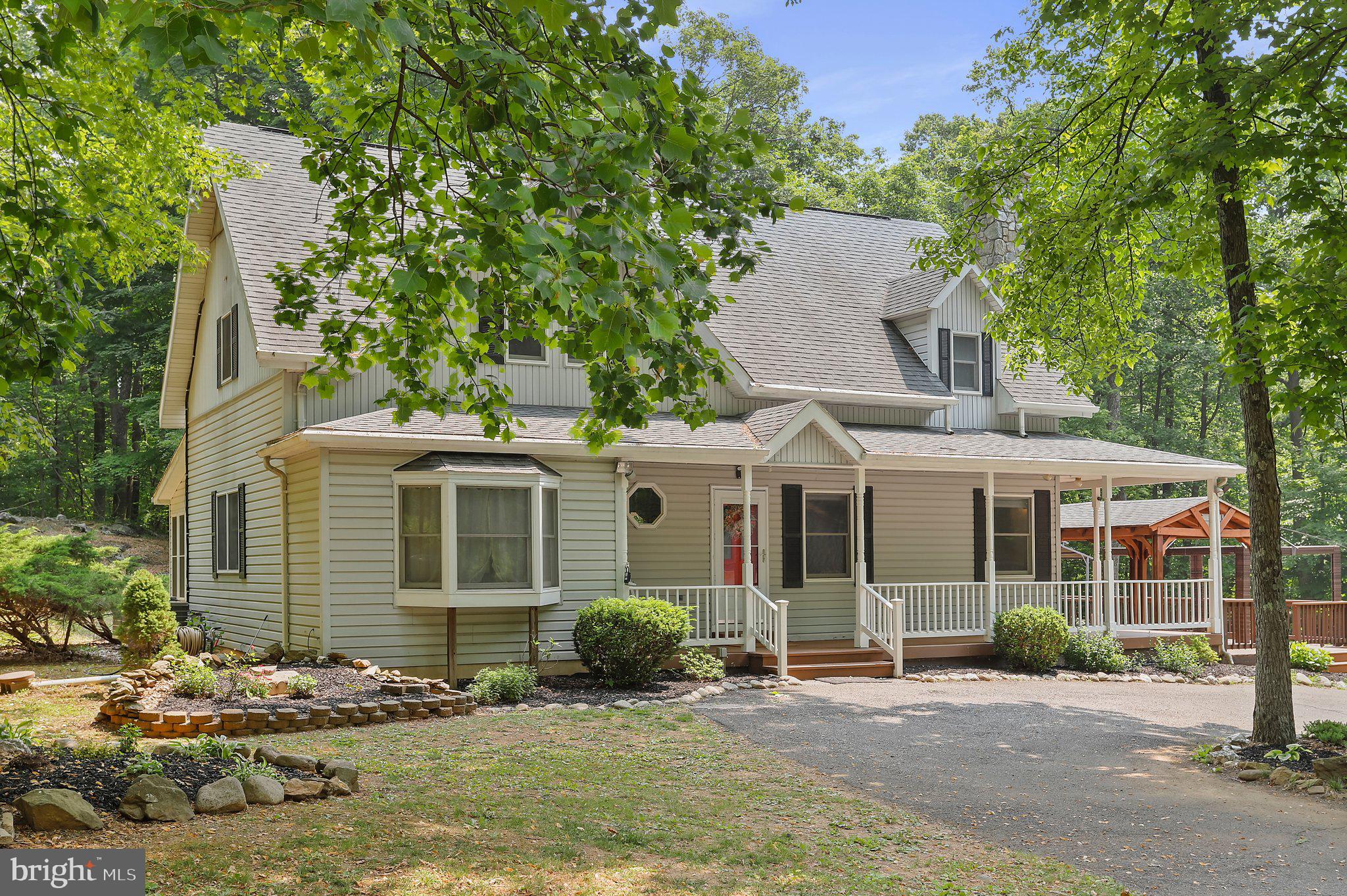 Don't miss out on this beautiful home! This modern colonial is situated on over four wooded acres in between Catoctin Mountain Park, Cunningham Falls State Park and the Frederick Watershed. An outdoor lovers dream, it is truly a mountain retreat! The main level is open and has new LVP throughout. This home is full of unique and charming features, ample storage space, and plenty of room for entertaining. There is a 1 bedroom, 1 bathroom apartment in the basement with a separate entrance that could be excellent income potential. The outdoor space is perfect for summer gatherings complete with a wrap around porch, decks, fire ring and grass space surrounded by mature trees. The oversized three car garage and two sheds boast plenty of storage, and workshop space. Recent upgrades include a newer septic field, basement and first floor HVAC unit replaced in 2020, second floor HVAC in 2022, and a new hot water heater in 2021.
- Offers are due by Wednesday (6/14) at 9am-