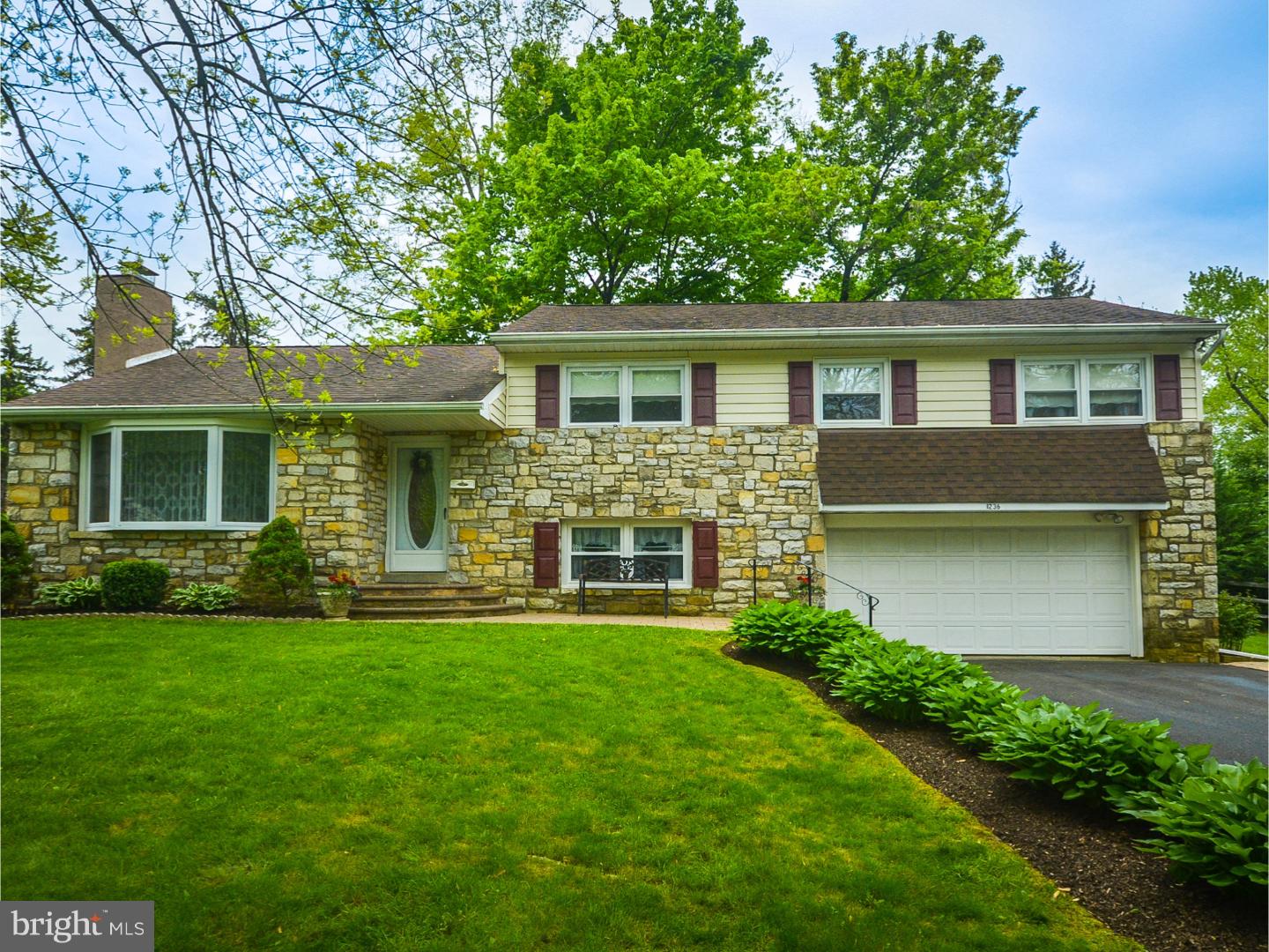 Mrs. Clean lives here in this beautiful home situated in a very private development setting in the highly rated Blue Ribbon School District of Central Bucks.  Picture yourself in this very nice Stone Split Colonial home with 4 Bedrooms and 2 1/2 Baths that is in excellent condition with pocket doors entering into this Chef's delight Ultra Modern Kitchen with 42" Maple Cabinets, ceramic tile backsplash and very nice upgraded Granite Countertops along with top of the line stainless steel Gallery Fridgedaire refrigerator, drop-in Stainless steel electric range, a new built-in dishwasher and new microwave. The kitchen also has super warm radiant heat in the floors and, oh yes there is a Flat Screened TV over the Microwave in the closet that is also included..  There are new wall to wall carpets in the living room along with a stone Fireplace for those cold winter nights.  Very nice Oak Hardwood floors through-out.  All four bedrooms are a generous size and the Master bedroom is very spacious with an updated tile master bath.  A nice Family room in the lower level with powder room and Laundry room with washer and dryer included.  Right off the large kitchen has a very large 10 month Florida room.  The lowest level is a large Basement that would be very easy to make into another Recreation room.  The heating system is a Newer Burham Oil hot water heater.  The home has Central Air through out.  Two car attached garage.  The grounds are very nicely manicured on an approximate 1/2 acre Lot.