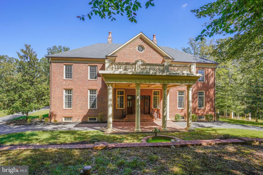One of a kind home on a grand scale with over 20,000 Sq. Ft under roof. Extensive moldings and finishing t. From the front portico double doors welcome you  to the Grand entry foyer with 26' rotunda opening to upper level with huge chandelier, 2 half baths and bar/coat check room. Huge LR & DR each Approximately 1100 Sq. Ft.  2 staircases to the upper level as well as an elevator.  Gourmet kitchen with 2 stone fireplaces, Viking appliances, large island and all custom made cabinetry, including butlers pantry and Family room, also with stone fireplace. The home features  a huge Owners suite with 2  large baths a sitting room with fireplace and wet bar, multiple walk in closets, opens to rear balcony overlooking brick patio. There are 3 additional bedrooms all with baths and 2 with sitting rooms, and one opening to large deck over the 28'X24' portico, upper level maids quarters with  LR,BR, full bath and 2nd kitchen for a total of 5 Bedrooms, 6 Full & 4 Half baths. From the foundation 16" thickness of steel reinforced poured concrete, to all brick exterior, to the 1000 amp electrical service, 1000 gal. propane tank 2X8 exterior walls & 2X6 interior, double thickness sub floors (1.5"), finished with Brazilian Cherry and Mahogany hardwoods,12' ceilings on first floor, 16' coffered on the mezzanine level 20 X 43 Ft. Sun Room, 10' on the 2nd floor,9' on on lower level and  4th floor, 6 fireplaces, Elevator servicing 4 levels, 8 zones of heating/cooling with touchscreen programmable thermostats. Over  the top construction built to last.  Lower level  has 3 large finished spaces and aprox. 3000 Sq. Ft. of additional space that can be finished if you need more, long enough for a bowling alley. Outside features 2 sets of electric gates, circular brick driveway, brick rear patio off sunroom. Large 3 car garage with oversized  doors and driveway parking area for many vehicles.