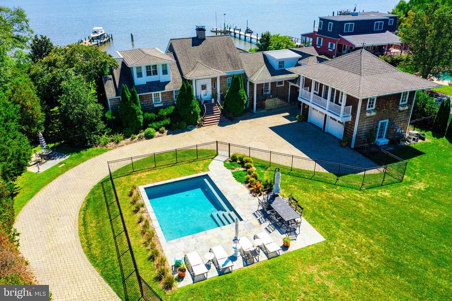 Price Improvement! Spectacular waterfront on the Chester River!!  Words can't describe the uniqueness of this property.  With the historic charm of an older home but  high end modern upgrades, you will be living the life of luxury.   Spacious rooms, magnificent views of the Chester River and your private dock with new boat lift, sandy beach, and stunning new saltwater pool.  Exposed beams, scalamandre wallpaper, and multiple fireplaces.  First floor owners suite featuring reclaimed pine flooring, private laundry area, walk-in closet, gas fireplace and remodeled bath with soaking tub. Second floor owner's suite with additional laundry area and remodeled bath.  Breezeway to the garage. New irrigation system to all flower beds. New paint inside and out.  House has had major remodels in 2000 and 2020. Town sewer.   Not far from town, but the property has a private feel.   Come and be amazed!!
