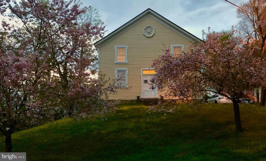 Nestled in the heart of historic Waterford, Virginia, this stunning converted church at 40221 Main St offers a truly unique living experience. Dating back to 1877, this culturally significant building has been meticulously restored, blending its rich history with modern amenities for comfortable living.
As you step inside, you're greeted by a spacious open floor plan with soaring ceilings and original hardwood floors, creating a loft-like atmosphere that's both grand and inviting. The focal point of the living space is the floor-to-ceiling bookshelves, adding character and charm to the room while offering plenty of storage for your favorite reads.
The kitchen, renovated in 2014, boasts modern appliances and ample cabinet space, making meal preparation a breeze. The full bathroom is equally stylish, featuring contemporary fixtures and finishes.
The original wood floors and plaster walls have been lovingly preserved, showcasing the craftsmanship of yesteryears. The building's historical significance is further highlighted by its inclusion in the National Trust for Historic Preservation Tax Credit program, ensuring its legacy for generations to come.
Whether you're looking for a unique home, a charming guest suite, or a distinctive office space, this converted church offers endless possibilities. Experience the charm of historic Waterford living in this one-of-a-kind property, where history meets modern comfort.