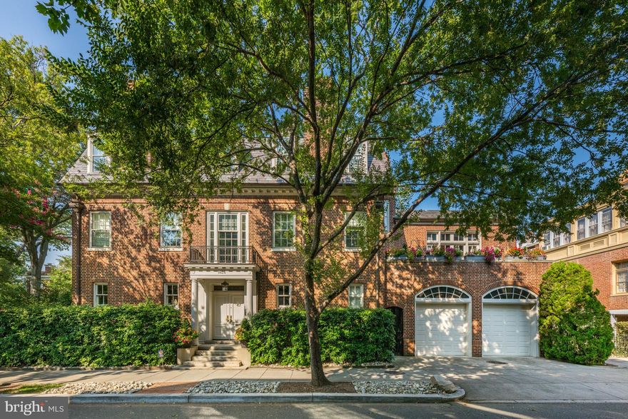 NEW LISTING! Welcome to 1824 23rd Street, NW in the coveted and revered neighborhood of Kalorama. Built in 1912, this detached Georgian Colonial has been completely restored and impeccably renovated within the last seven  years. This special residence is very impressive upon entering the spectacular double doors at the main entrance. The vestibule features and intricate patterns of mosaic tile with the street address of “1 8 2 4” inlaid. Another set of double doors leads to an expansive Entrance Hall. The Entrance Hall consists of views to the Living Room, Dining Room, a grand staircase to upper levels. There is also a coat closet and lovely Powder Room in the Hall. The polished nickel washstand with glass rails, by Waterworks, is one of the many stunning features of the Powder Room.

One is immediately impressed with the original architectural elements, such as American chestnut ceiling beams, wood trim, moldings and pocket doors. The Living Room is of substantial expanse and offers multiple seating arrangements. This room is washed in sunlight and boasts multiple windows and doors looking onto the private Terrace and an ornate gas fireplace.

The formal Dining Room is adjacent to the Entrance Hall and Living Room. This room is perfect for grand-scale entertaining or intimate family gatherings. There are two sets of pocket doors and also a door into the Butler’s Pantry, which is adjacent to the Kitchen. Upon entering the Butler’s Pantry, one notices a plethora of cabinets and storage, a bar sink and a wine refrigerator.

The Kitchen rounds out the main living level. There is a large table, stainless steel appliances, hand-crafted cabinetry by WoodMode and nickel finishes, and honed Carrara Supreme marble counters. The flooring in the Kitchen and Mudroom is limestone by Ann Sacks. There is also a separate staircase which leads to the lower level plus the additional floors above.

After ascending the main staircase, there is a separate entrance to an expansive and formal Library. The Library features numerous shelves and cabinets throughout the entire room. There is a fireplace and door leading to a small balcony overlooking 23rd Street. Adjacent to the Library is a Sunroom for a multitude of uses. On this second level there is a private Den, an ensuite Bedroom and the first of two Primary Suites. The Primary Suite on the second level is quite generous in size and proportions. This Suite also boasts a lovely Sitting Room, an ensuite Full Bath with dual vanities and a large walk-in closet.  This Suite also has a gas fireplace.

The third level of this residence features yet another Primary Suite with a Juliet balcony overlooking Bancroft Place and views to Mitchell Park, an ensuite Full Bath, a fireplace and an extremely large walk-in closet. This level also consists of a Hall Bath with soaking tub and two more Guest Bedrooms.
The Lower Level has a multitude of large Storage Rooms, a Fitness Room which could also be used as a Guest Bedroom, a Washroom, and a Full Bath. There are two more exterior Storage Rooms in the back of the home.

Some of other notable features: an attached Two-Car Garage and a large gated and private Terrace adjacent to the Living Room.

This residence is located across the street from Mitchell Park. The Kalorama neighborhood is known to be the home of many diplomats, dignitaries, and embassies, just to name a few. Close proximity to Dupont Circle, Woodley Park, Georgetown, Rock Creek Park and Rock Creek Parkway. 1824 23rd St, NW offers convenience, residential privacy and urban liveliness all in one spectacular location.