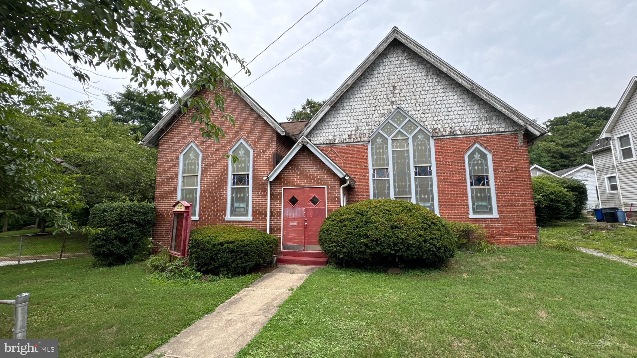 You won't find anything in the Wayne-Radnor Area under $1,000,000 with a lot this size!!!! This is a steal in the area!!! Let's make a deal!!
Step into a piece of Radnor Township's rich history with this enchanting church, a community landmark for over 130 years. Its majestic sanctuary boasts soaring vaulted ceilings, framed by exquisite antique stained glass windows that bathe the space in ethereal light.
Beyond the main hall lies a quaint fellowship area, thoughtfully equipped with a full-service kitchen, restrooms, and an office—ideal for gatherings, events, or organizational needs. Adjacent to the church stands a character-filled four-bedroom parsonage awaiting your personal touch. Previously utilized as a rental, this residence offers a canvas for transformation, whether as a pastoral home or a customized rental living space.
The property's C-1 zoning unlocks a spectrum of possibilities. With township approval, envision rezoning to residential, crafting a bespoke dream home, or exploring other permitted ventures. While the church currently benefits from parking arrangements with the neighboring dental office and nearby parks—including Friends of Radnor Trails Park, Odorisio Park, and Ralph DiMaio Field—the location itself is unparalleled. Nestled against the serene Radnor walking trail and merely a stroll away from downtown Wayne, esteemed schools, lush parks, and public transit, convenience is at your doorstep.
Offered in its "AS IS" condition, this property beckons visionary buyers ready to restore and rejuvenate. The seller is motivated—seize this opportunity and present your offer today!