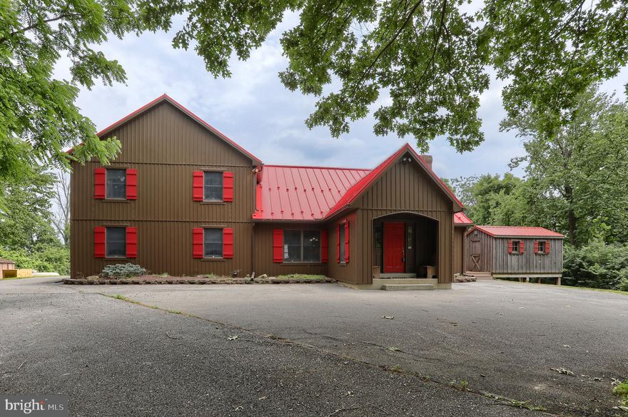 HAVE IT ALL! Beautiful and newly renovated home, outbuildings, and garages on THE MOST INCREDIBLE LAND perked high on the hills of Reinholds!! (105.69 acres in Clean and Green) Soak in the amazing views overlooking Lancaster County! This land has 11+ elevated and enclosed deer stands equipped with roofs, windows, portable propane heaters and 20+ miles of majestic views all around. The property has groomed trails throughout which allows you to enjoy every aspect of the land and 2 ponds. The sparkling man-made pond with fountain has a depth of approx. 10ft and is fed by a well and is stocked with Trout and Koi. Throw in the feed and the fish will come!  Hunt, hike, ride, and fish all on your own land. The access to the property is a gated paved driveway for security. This home offers over 3700 square foot of indoor living space and over 1000 sq ft of outdoor living space with composite deck and screened in porch with ceiling fan. 5 bedrooms and 4 full baths, gorgeous stone wood burning fireplace with built storage and outside access to stack your wood, high wood ceilings in the main area give off that rustic feel with window placement giving off an abundance of natural light. Leather granite countertops with a live edge throughout the bathrooms and kitchen. Wake up in the mornings and make bacon and eggs on the new Kitchen Aid 30” electric cooktop or built-in griddle. This kitchen also features 2 refrigerators, double ovens, tile backsplash, and appliance garage. The loft features a 26-gun lighted display case. Whole house water purification, water softener, and backup generator w/propane that can last up to 10 days. This is a once in a lifetime opportunity to own one of the finest properties in all of Lancaster County!