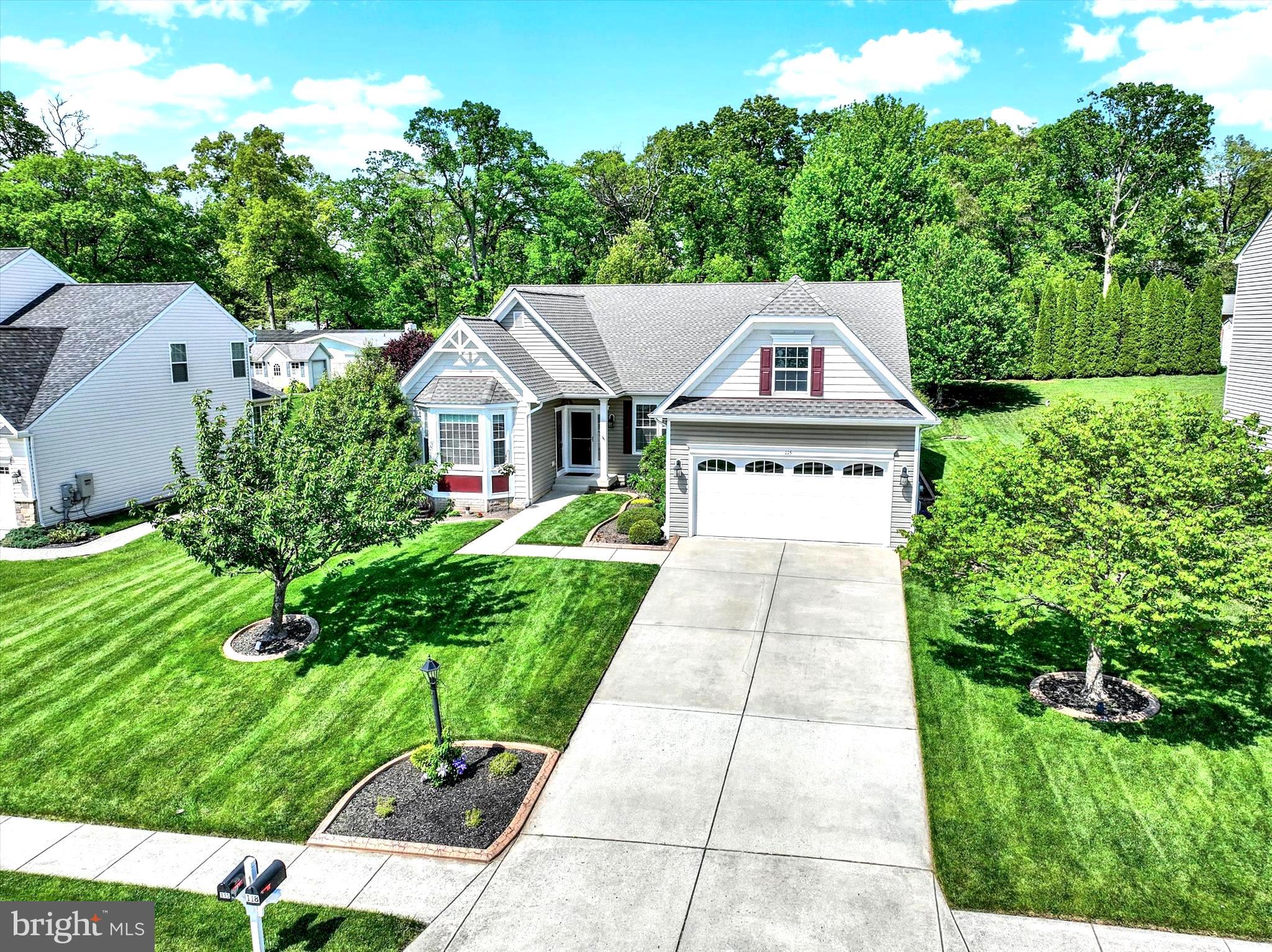 Welcome home. Introducing 115 Vista Loop. Custom built luxurious home surrounded by gorgeous farmland yet minutes to shopping/dining. This fantastic, cherished property awaits your admiration. If you're looking for a home with an open versatile layout that adapts to your lifestyle, this one deserves serious consideration. It features a bonus secondary suite with its own private front entrance and private bath—an ideal set up for a live-in parent, college student, or adult child who needs both independence and support. A truly convenient and flexible living solution. This home is brimming with thoughtful features that showcase the exceptional care, quality, and attention to detail invested in every corner of the property. Recent updates, including a brand-new roof installed in March, a newer hot water heater, and a meticulously maintained HVAC system, provide added peace of mind for years to come. As you explore the grounds, you'll be struck by a sense of calm and relaxation, the beautifully maintained exterior and landscaping create a truly serene atmosphere. At the end of the day, unwind in your stunning outdoor living space. Picture yourself on the back patio, taking in the peaceful surroundings, lush flowering trees, and breathtaking hardscaping. It's easy to imagine a quiet Saturday morning, coffee in hand, listening to birdsong. Whether you're entertaining guests or enjoying a quiet evening grilling, this space is the perfect outdoor retreat. The beauty of this home continues inside. Step into a spacious and inviting foyer that immediately makes you feel at home. To the right, you'll find a generous formal dining room—perfect for hosting holiday gatherings and special occasions. The dining room flows seamlessly into the stunning, well-appointed kitchen, passing by an adorable built-in coffee bar—an ideal touch for both everyday convenience and effortless entertainment. To the left of the foyer is the first of two-bedroom suites, featuring its own private entrance—offering flexibility, privacy, and convenience. From the foyer, head straight into the stunning living room—a space that truly welcomes you home. Centered around a beautiful gas fireplace, the room offers just the right touch of warmth and ambiance, setting the perfect mood whether you're relaxing alone or entertaining guests. Open to the living room is the gourmet kitchen—designed to inspire your inner chef. With an abundance of upgraded cabinetry, sleek granite countertops, and ample prep space, it's perfectly equipped for everything from quick weeknight dinners to elaborate meals. The kitchen also features a charming breakfast nook, perfect for casual meals or morning coffee. From here, enjoy direct access to your patio and backyard oasis—creating a natural flow that makes entertaining both easy and enjoyable. Just off the kitchen, you'll find two additional spacious bedrooms, each featuring walk-in closets for ample storage. This area also includes a full bathroom, offering comfort and convenience for family or guests. For added privacy and convenience, the spacious primary suite is located on the opposite side of the home, just off the living room. This serene retreat features a large walk-in closet and a beautifully appointed private bath, complete with a luxurious walk-in shower and a separate vanity area—perfect for your daily routine. The full walk-out basement offers endless potential, ready to be customized to suit your needs. It leads directly to the stunning brick patio and beautifully landscaped backyard, enhancing your living space. As you can see, this home is truly one of a kind and is sure to exceed your expectations!