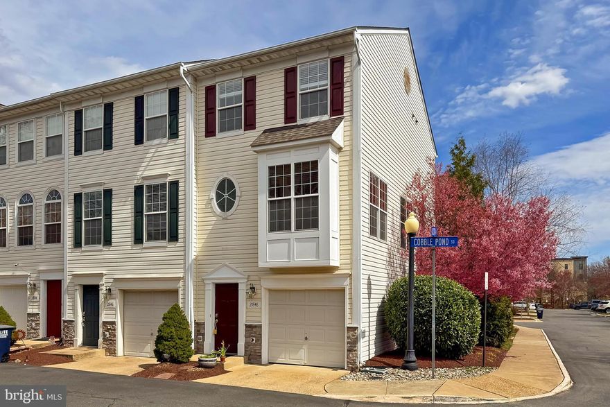 Welcome to this beautifully maintained end-unit townhouse that offers an abundance of natural light and a spacious layout. With 3 bedrooms, 3.5 bathrooms, and a walk-out lower level, this home is designed for comfort and convenience. Enjoy the added benefit of a 1-car garage with an assigned parking space, plus an additional visitor parking pass for guests. The property boasts a fully fenced backyard, perfect for outdoor relaxation or entertaining. A relaxing deck overlooks the custom paver patio below, providing a wonderful space for lounging. Inside, gleaming hardwood floors on the main level create a warm and inviting atmosphere. The open floor plan seamlessly connects the kitchen and family room, where a breakfast bar makes it easy to entertain guests or keep an eye on loved ones. Situated just 0.7 miles from the Ashburn Metro Station, commuting is a breeze, while easy access to the Greenway connects you to Dulles Airport, Dulles Toll Road, and Leesburg. You’ll also be surrounded by an array of amenities, including supermarkets, restaurants, a movie theater, library, hardware store, breweries, gyms, parks, Kaiser Permanente, and more. Everything you need is right at your doorstep. Don't miss out. Schedule your tour today! ***Upgrades and maintenance - carpets cleaned 3/25/2025, washer, dryer & dishwasher 2024, smoke  & carbon monoxide detectors 2023, refrigerator 2020, roof 2019***